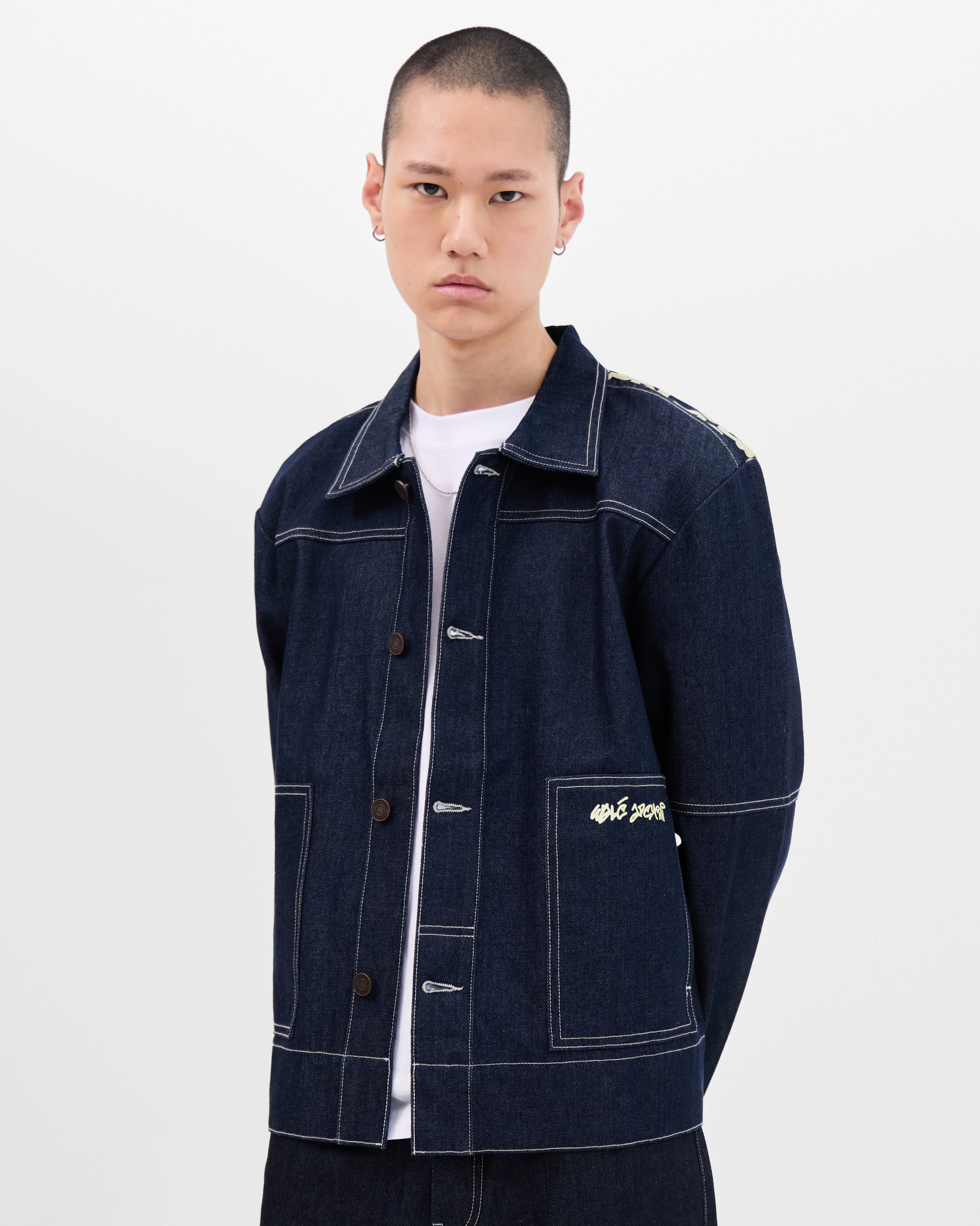 Model wearing the Walé Adeyemi Archive Graf Denim Jacket in Navy/Lemon, front view