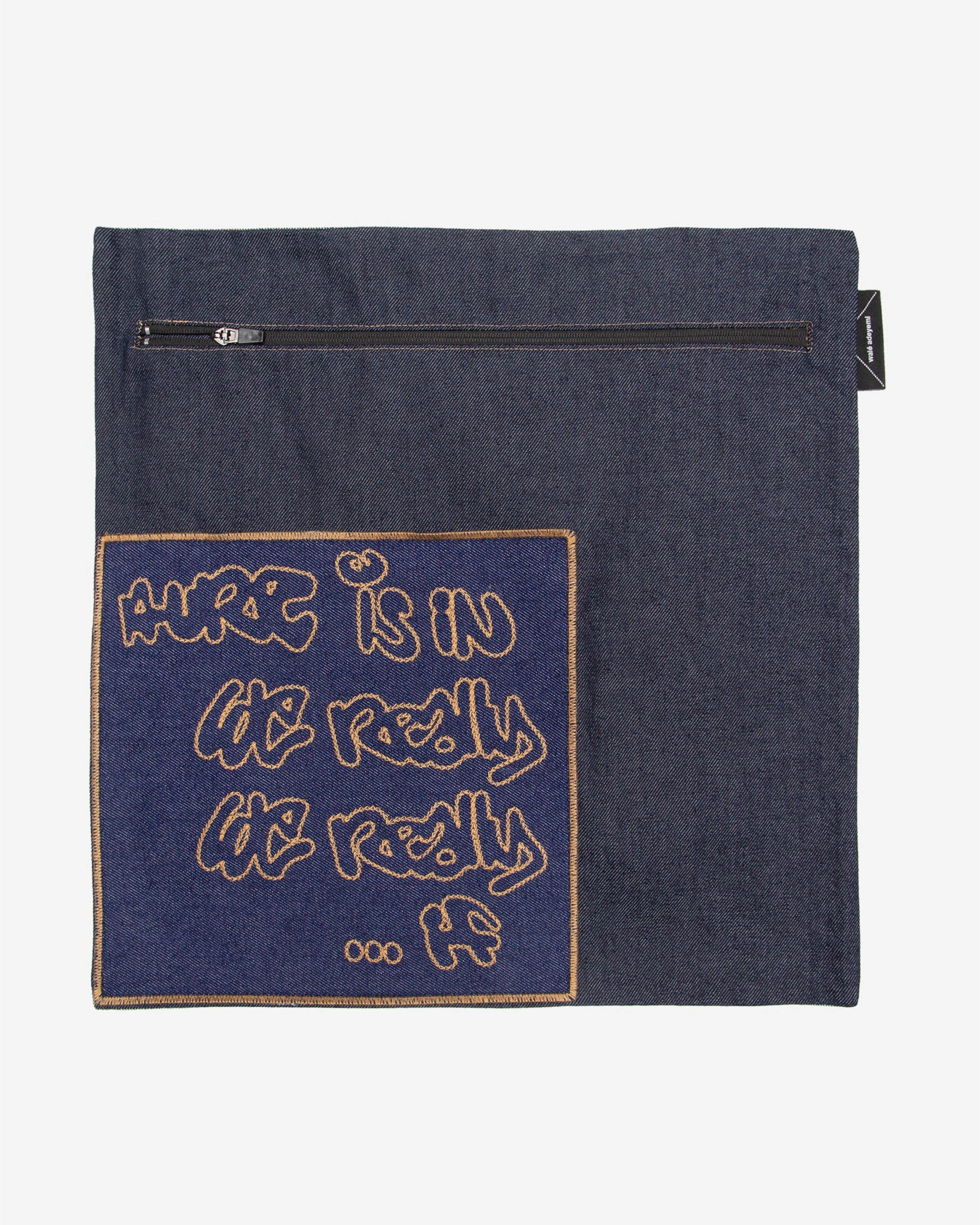 Styled view of the Walé Adeyemi Denim Sleeve Cushion No. 2