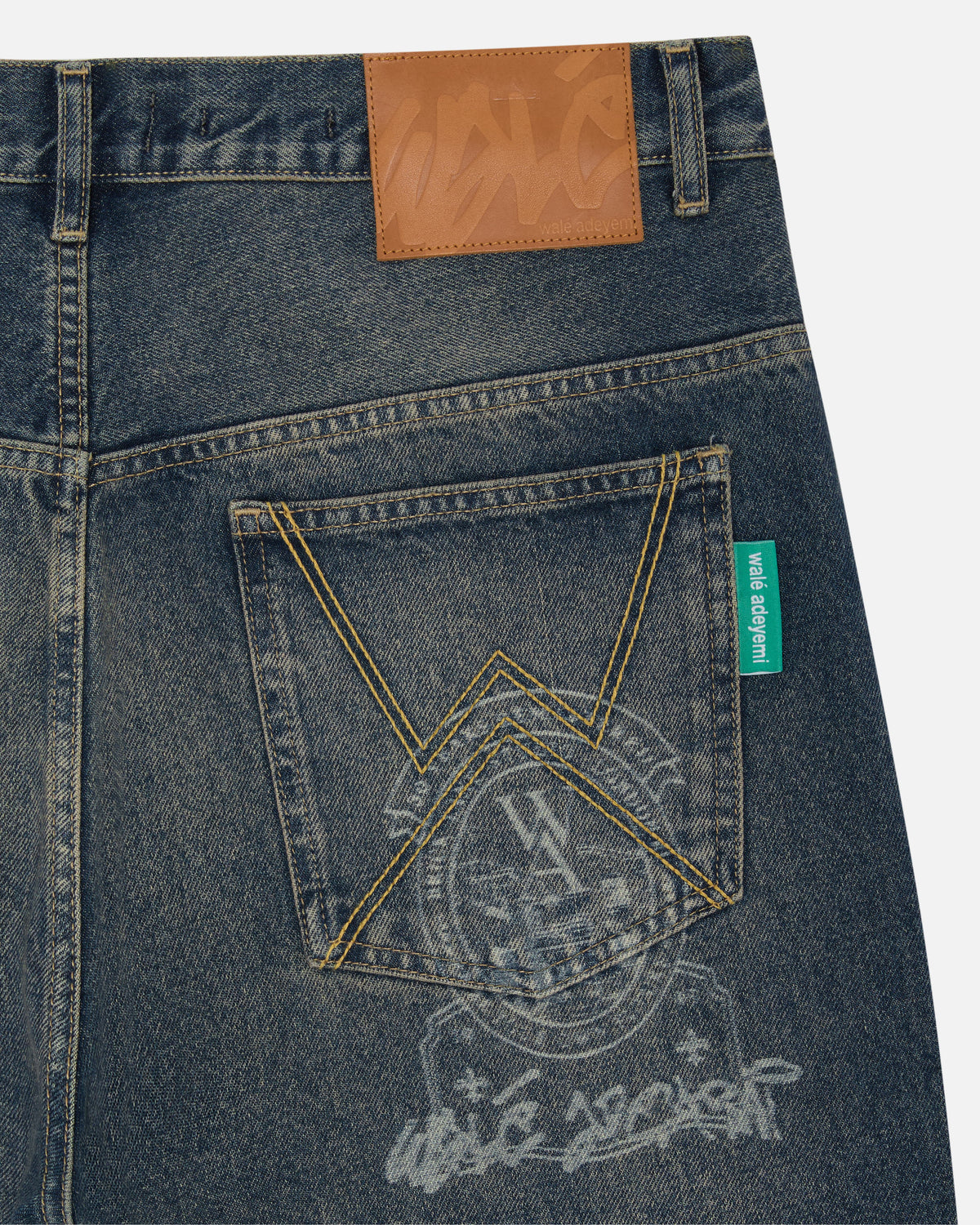 Walé Adeyemi Masters Denim Jeans in Tinted Dark Wash, lasered crest detail