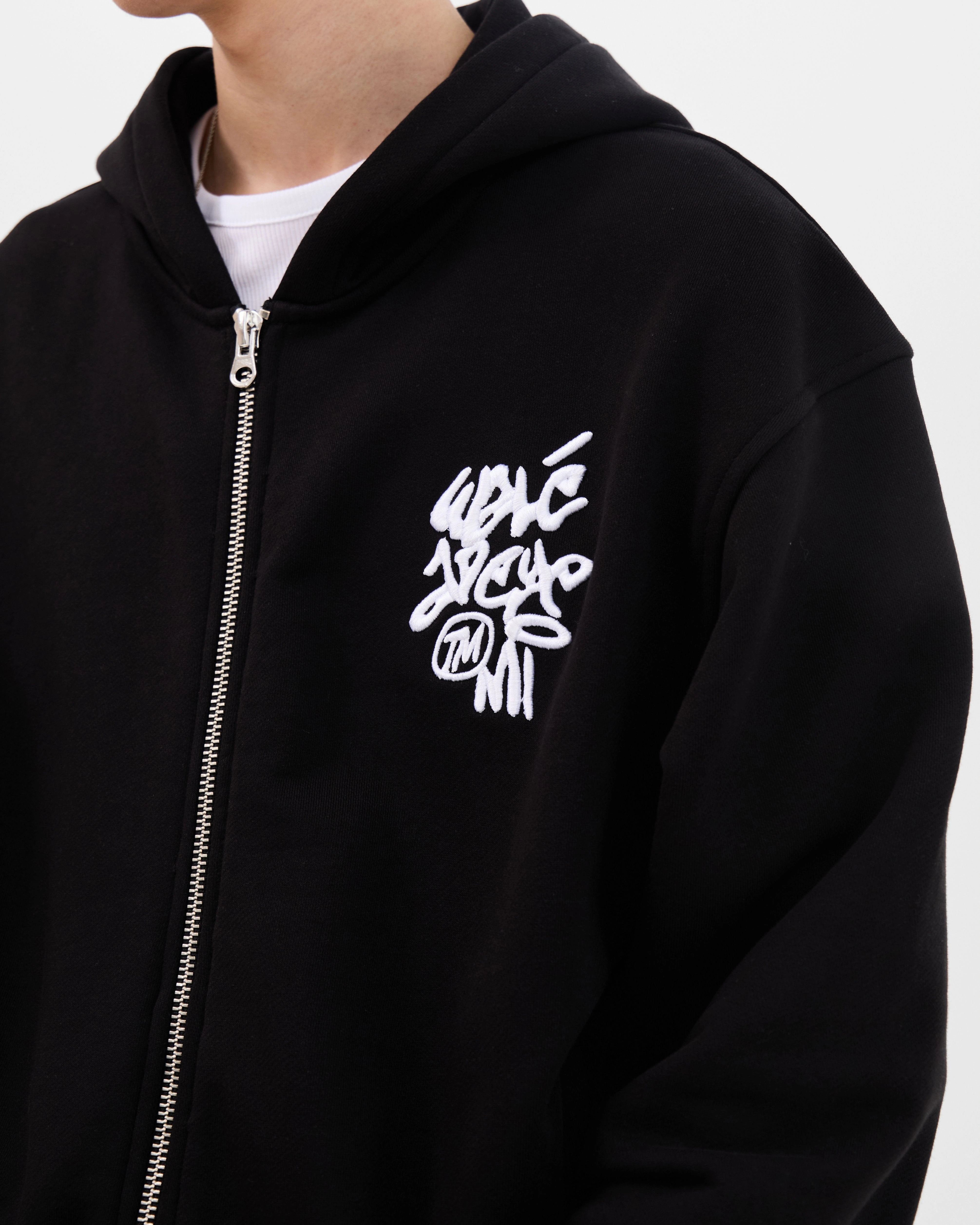Close-up of the chest logo on the Walé Adeyemi Vinnie Hoodie in Black/White