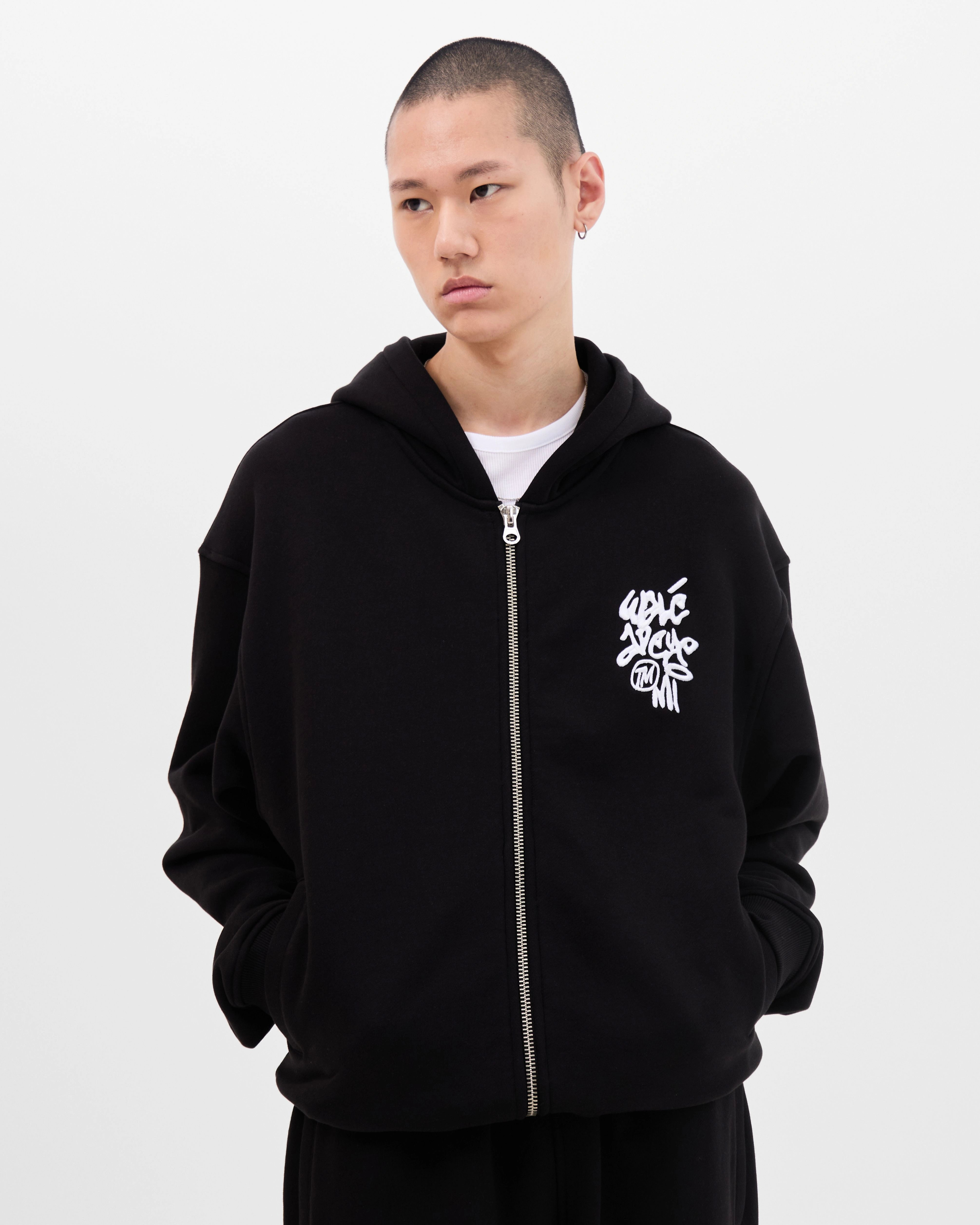 Model wearing the Walé Adeyemi Vinnie Hoodie in Black/White, front view