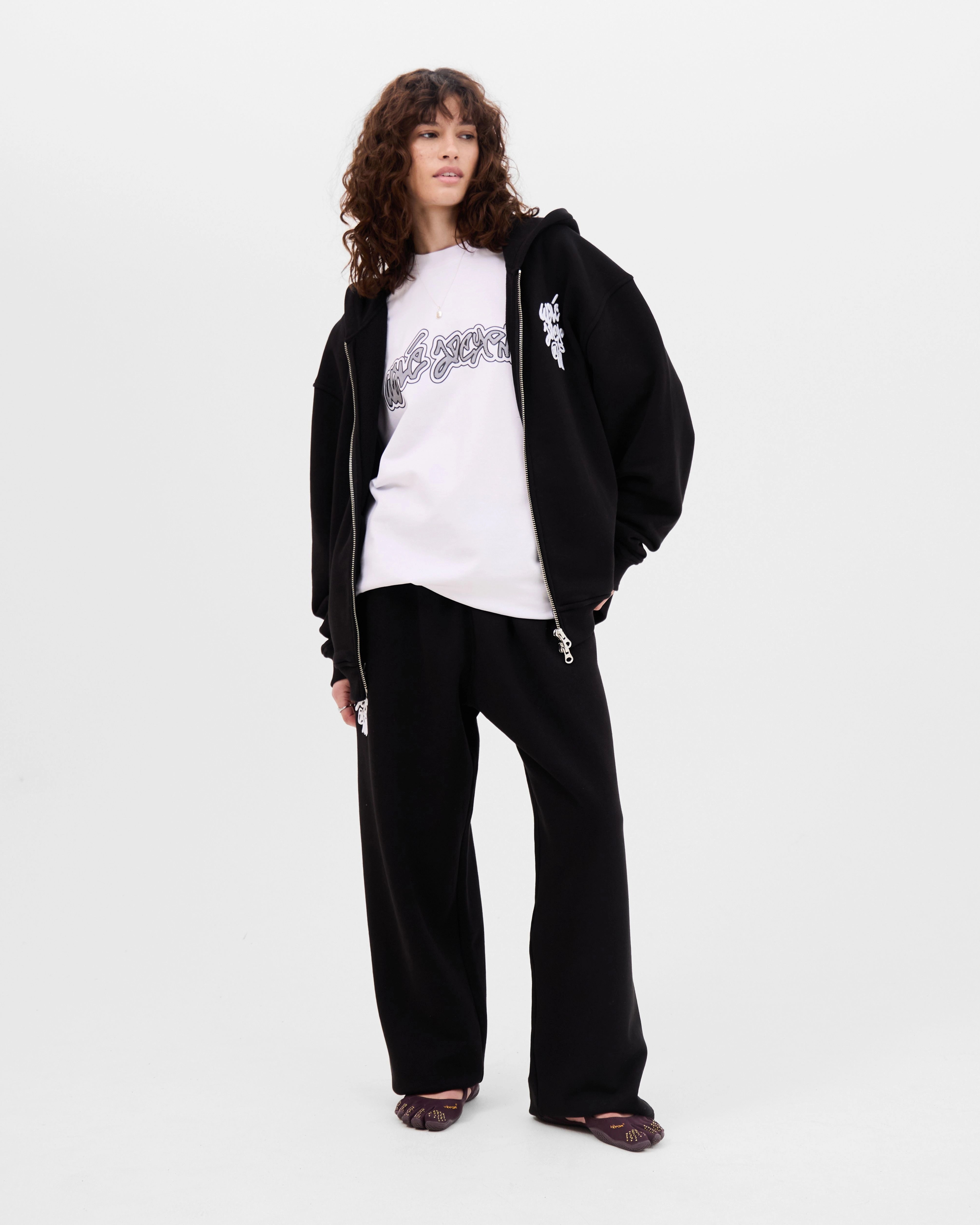 Model wearing the Walé Adeyemi Vinnie Hoodie in Black/White, alternate front view