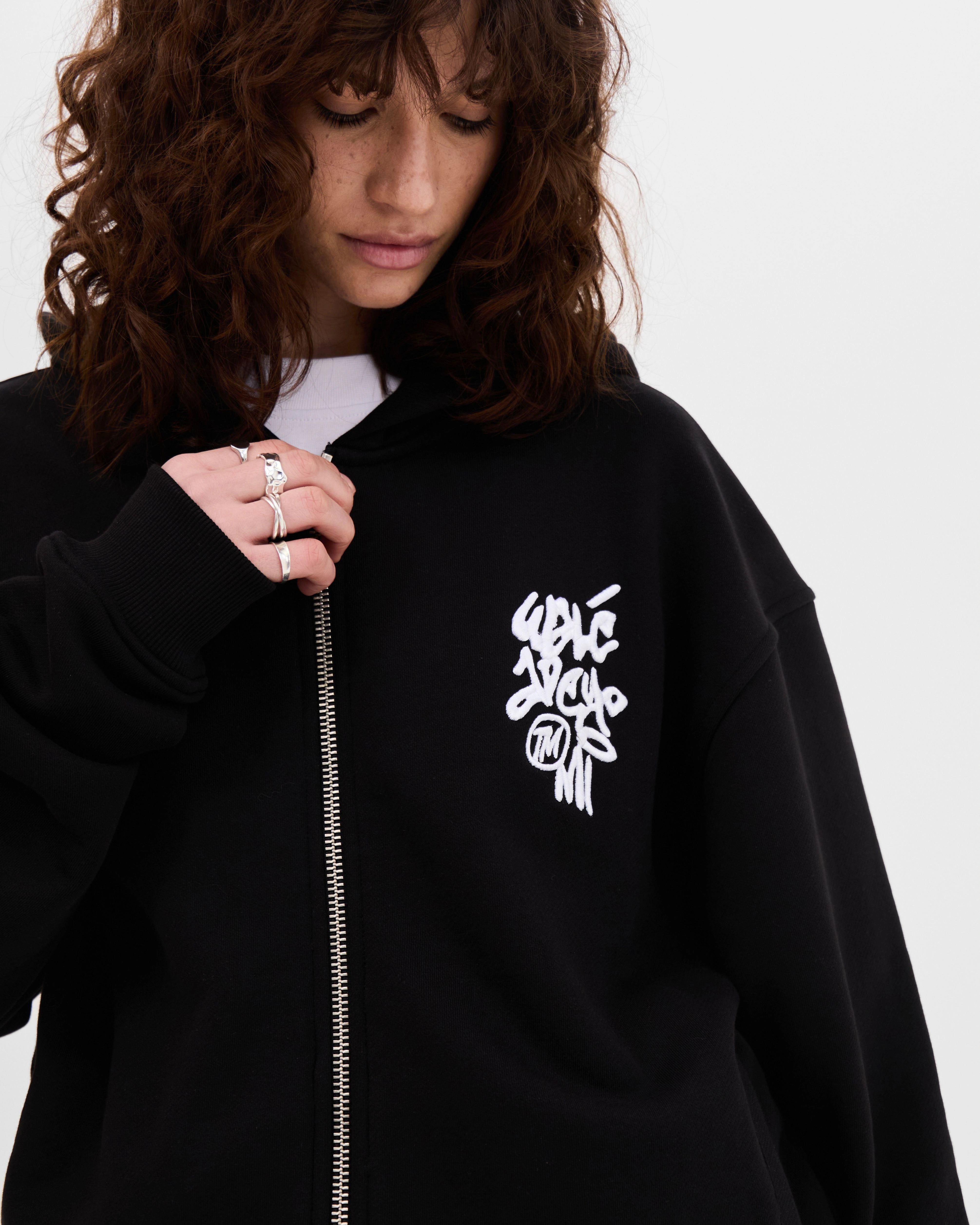Model wearing the Walé Adeyemi Vinnie Hoodie in Black/White, close front view