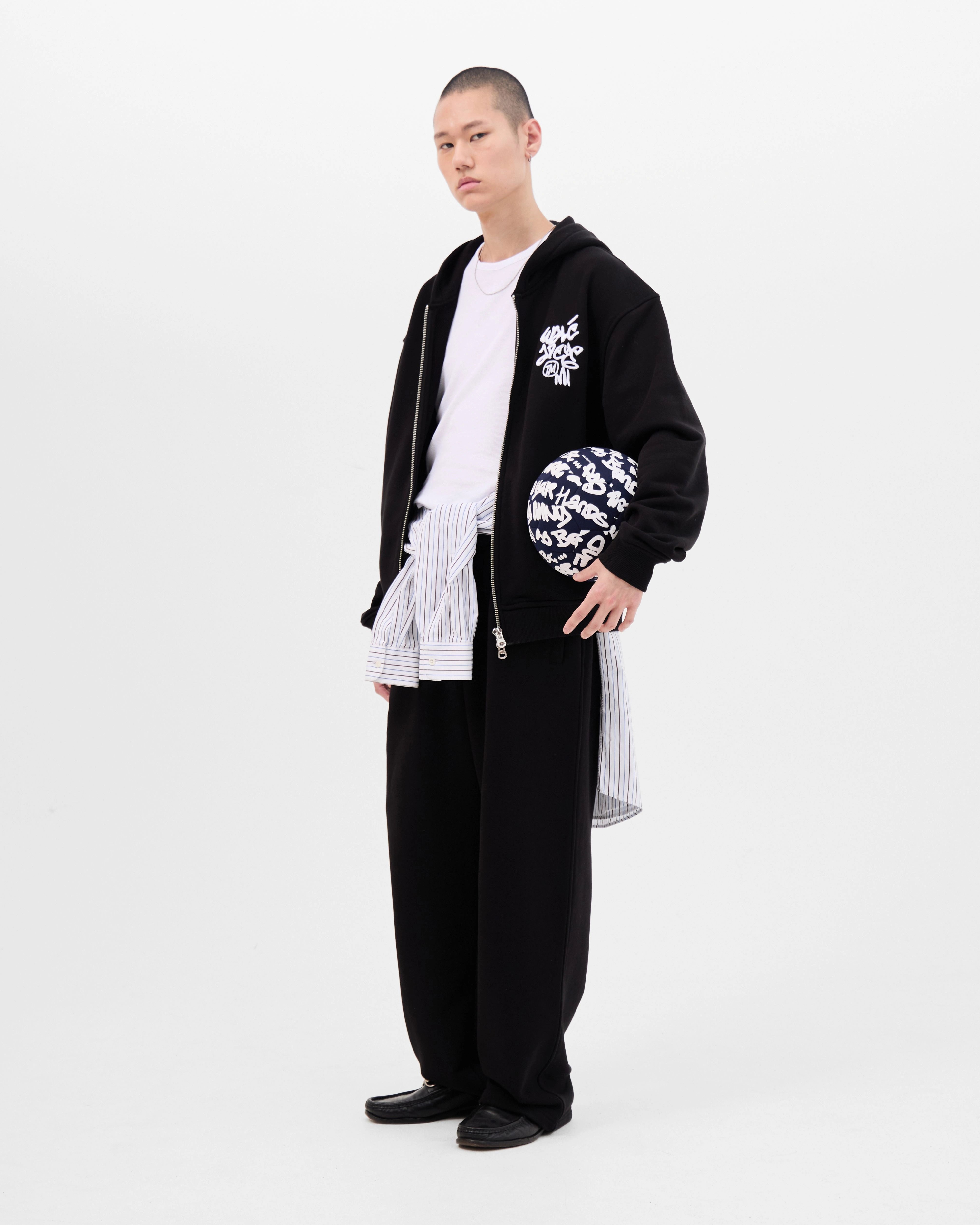 Model wearing the Walé Adeyemi Vinnie Hoodie in Black/White, full front view