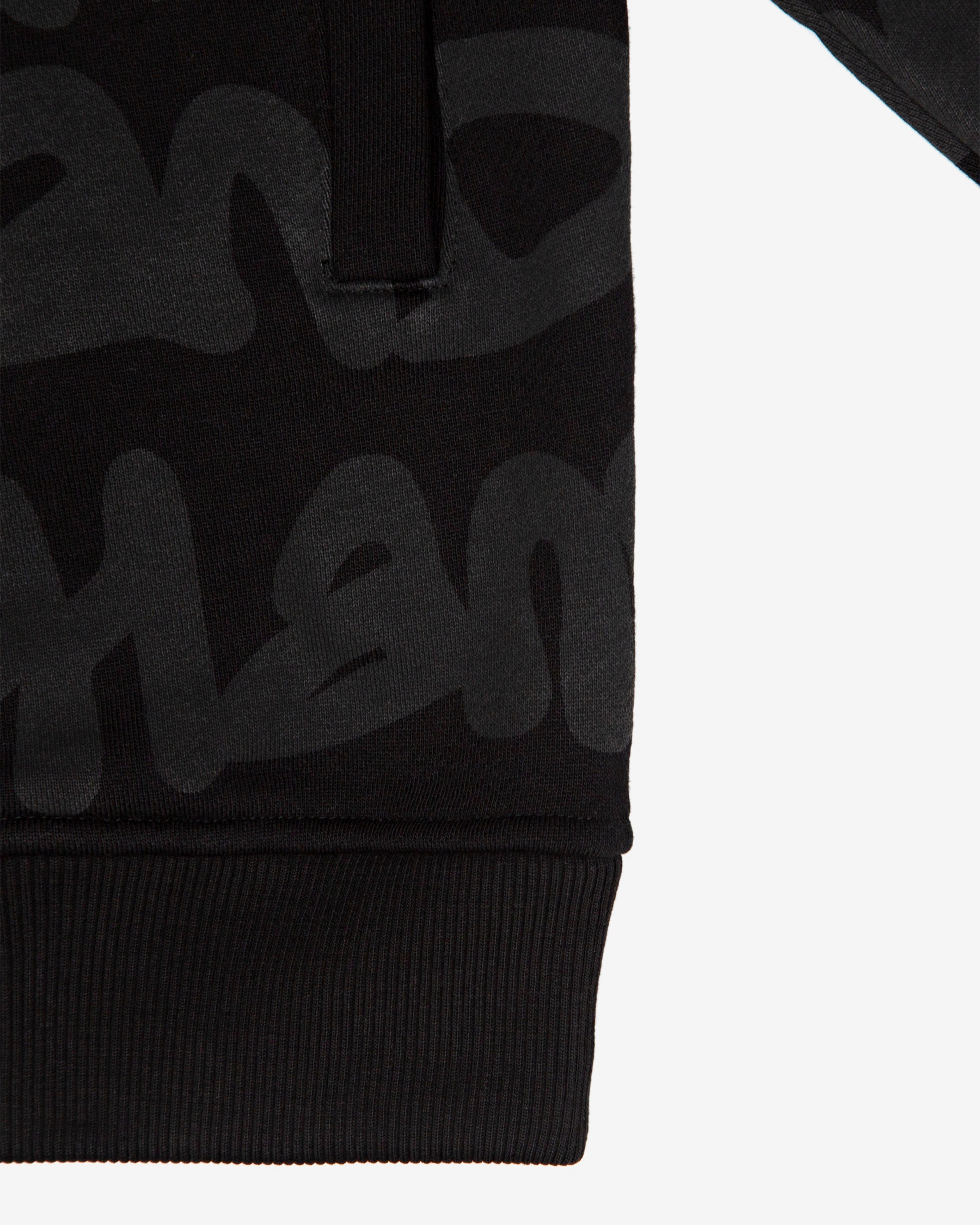 Close-up of the hem on the Walé Adeyemi AOP Graf Hood in Black