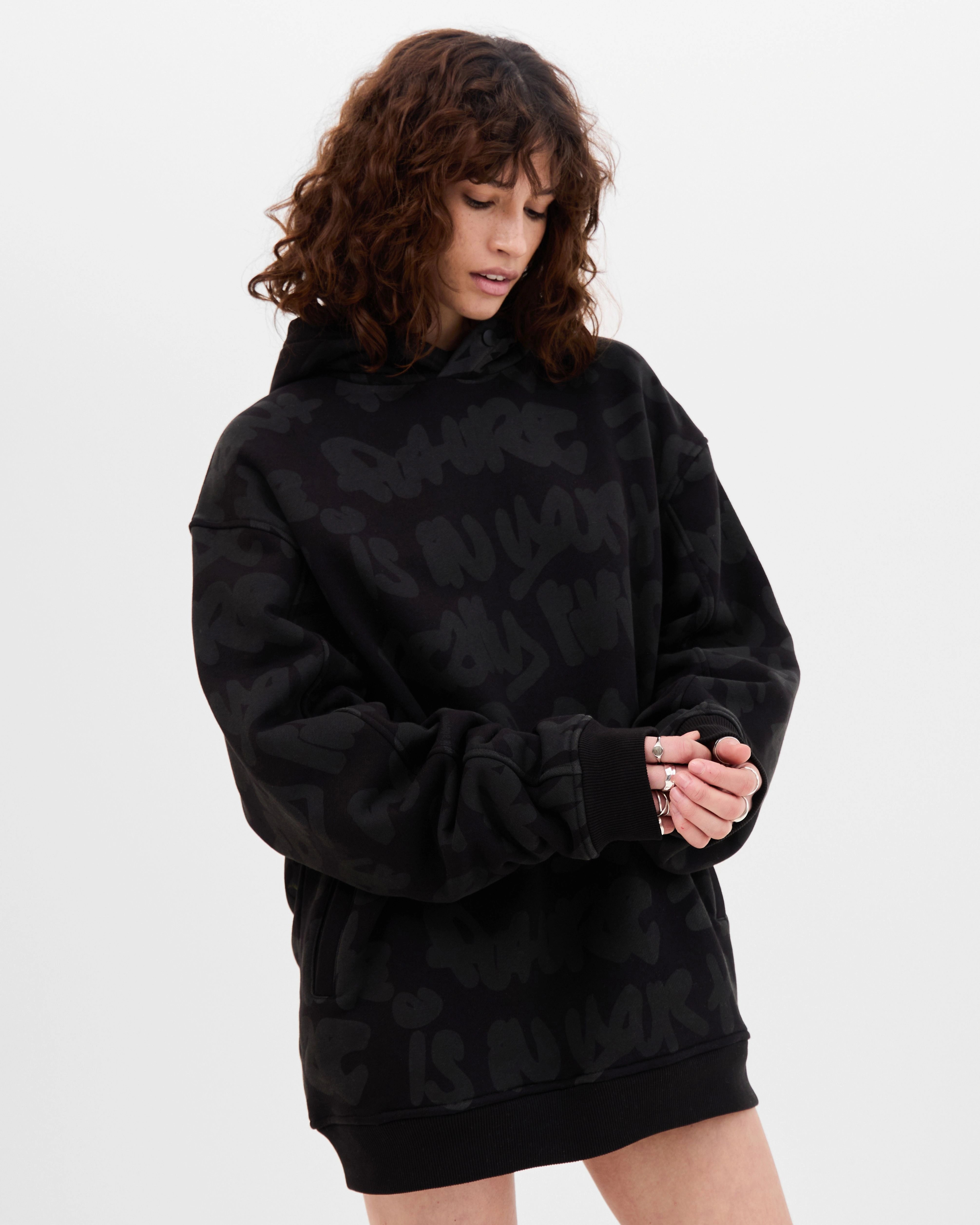 Model wearing the Walé Adeyemi AOP Graf Hood in Black, alternate front view