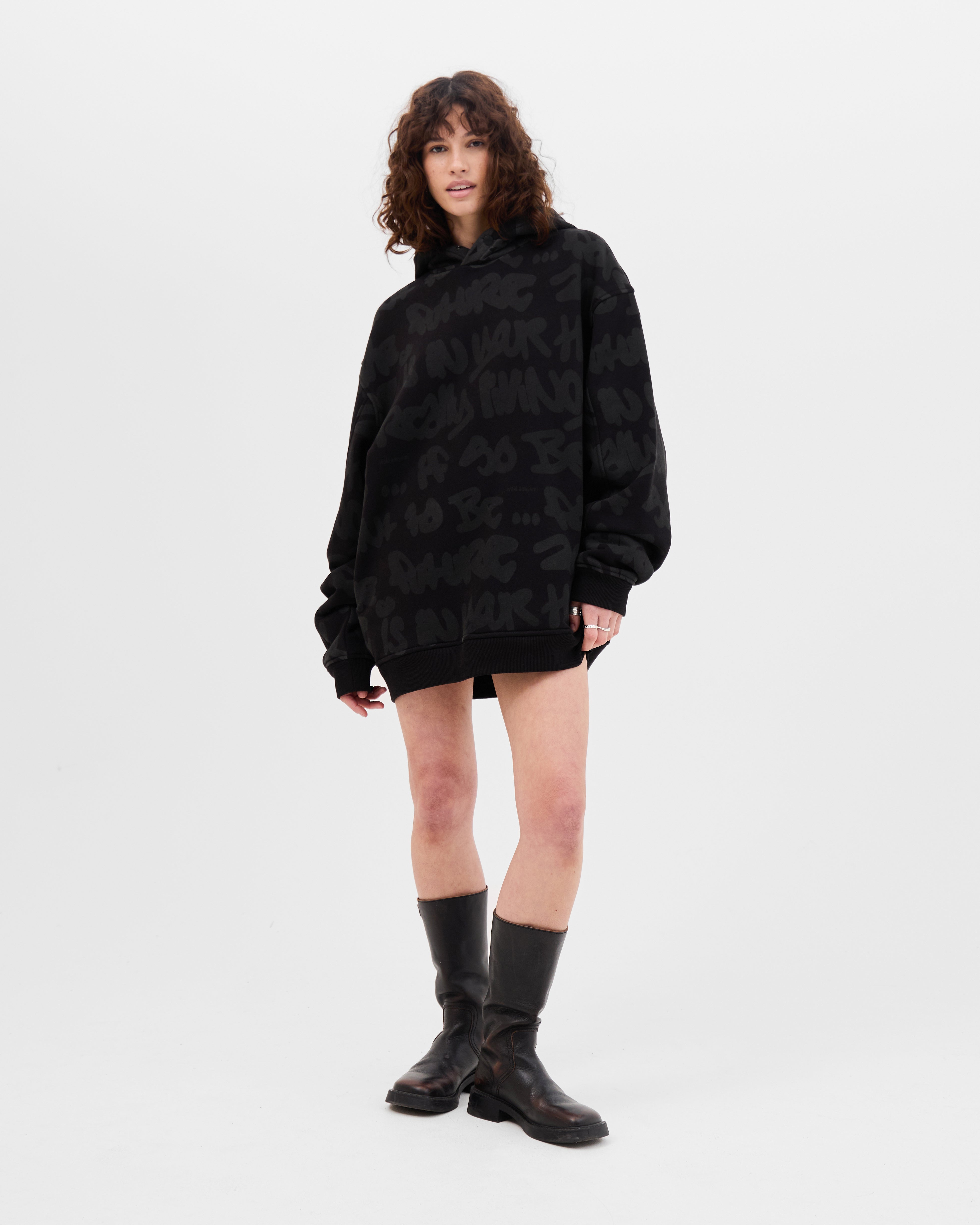 Model wearing the Walé Adeyemi AOP Graf Hood in Black, oversized fit, full-length front view