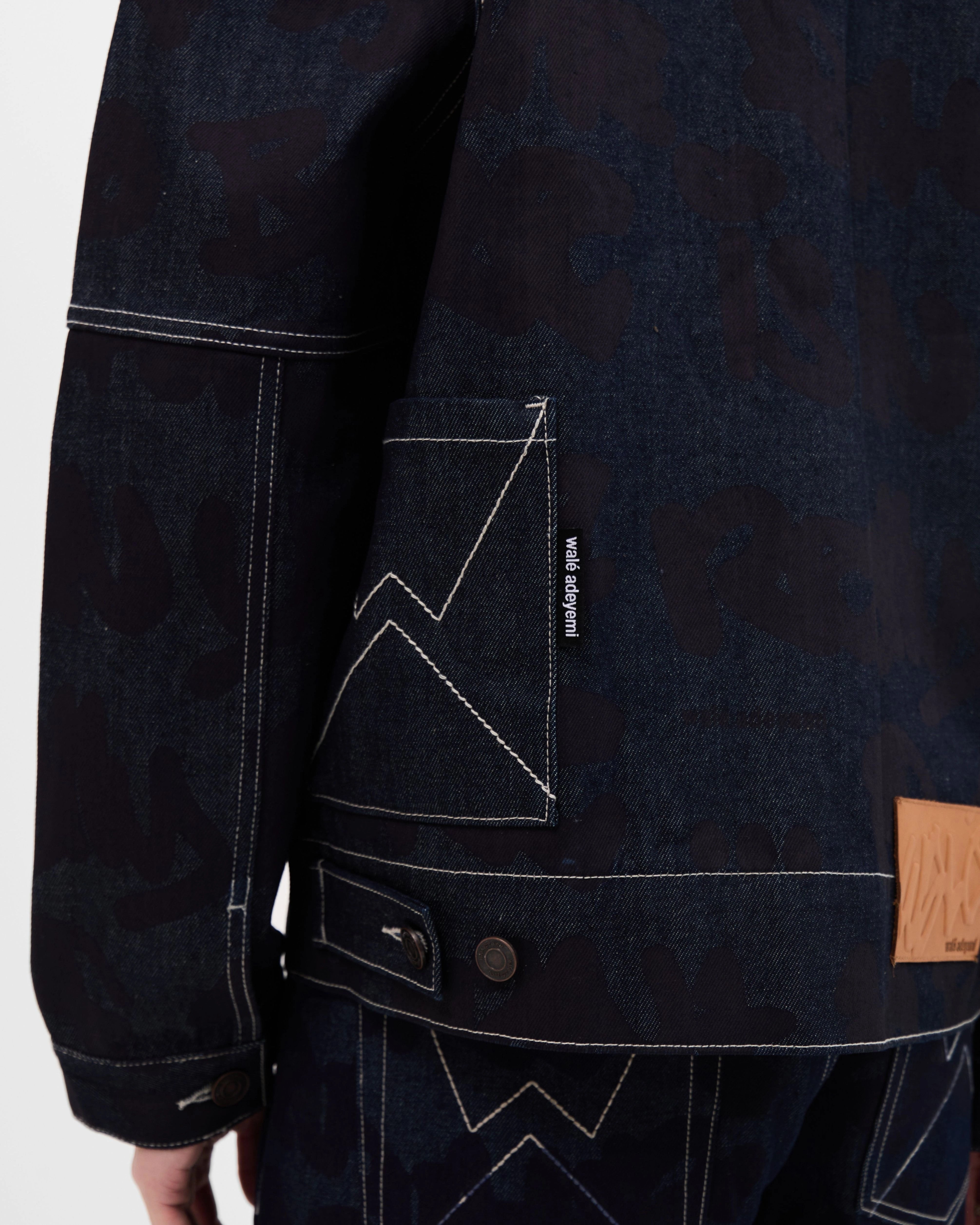 Model wearing the Walé Adeyemi Sound Clash Denim Jacket in Navy/Blue
