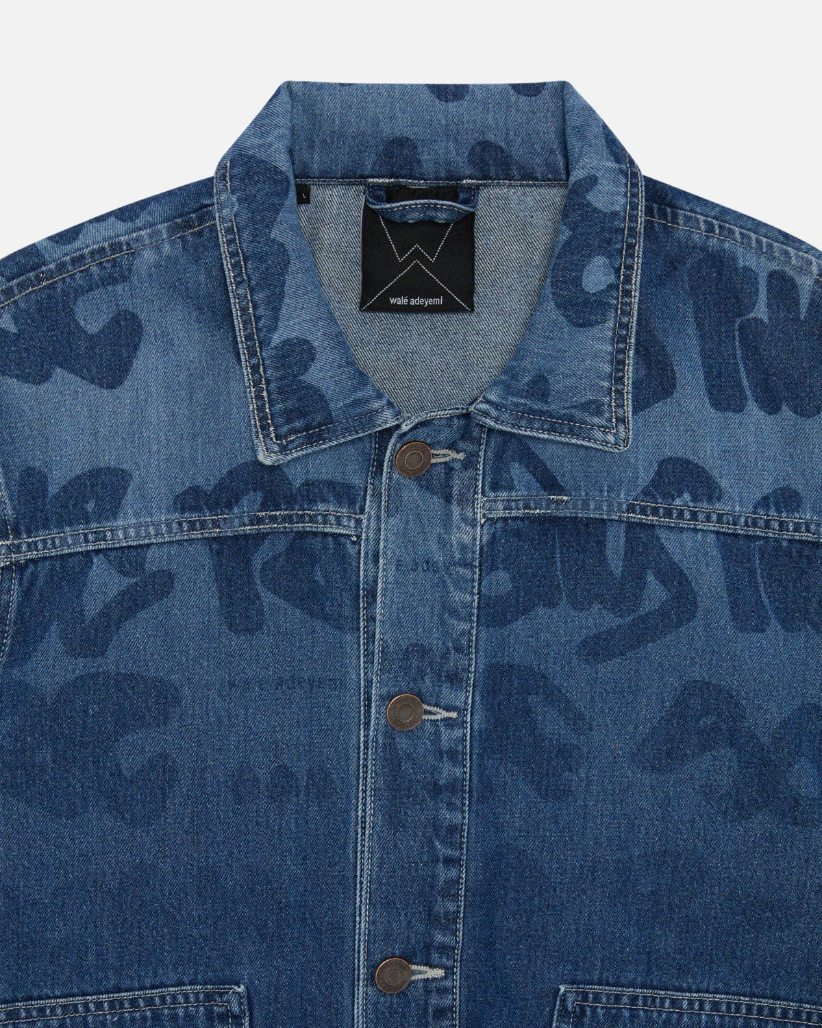 Close-up of the lasered Graf on the front yoke of Walé Adeyemi Ghost Denim Jacket in Ink