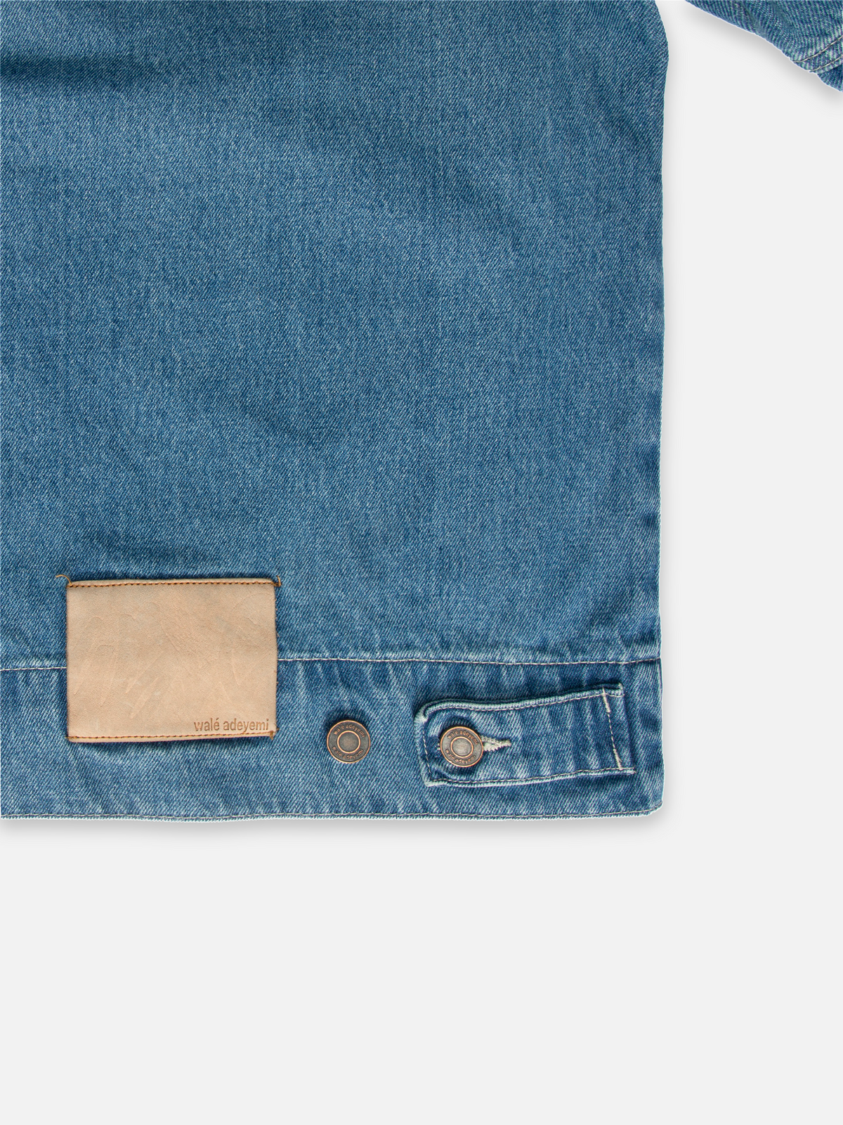 Close-up of the back patch on Walé Adeyemi Phantom Denim Jacket in Faded