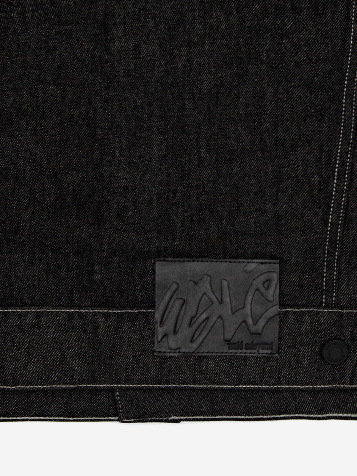 Close-up of the patch on the Walé Adeyemi Midnight Graf Denim Jacket in Black