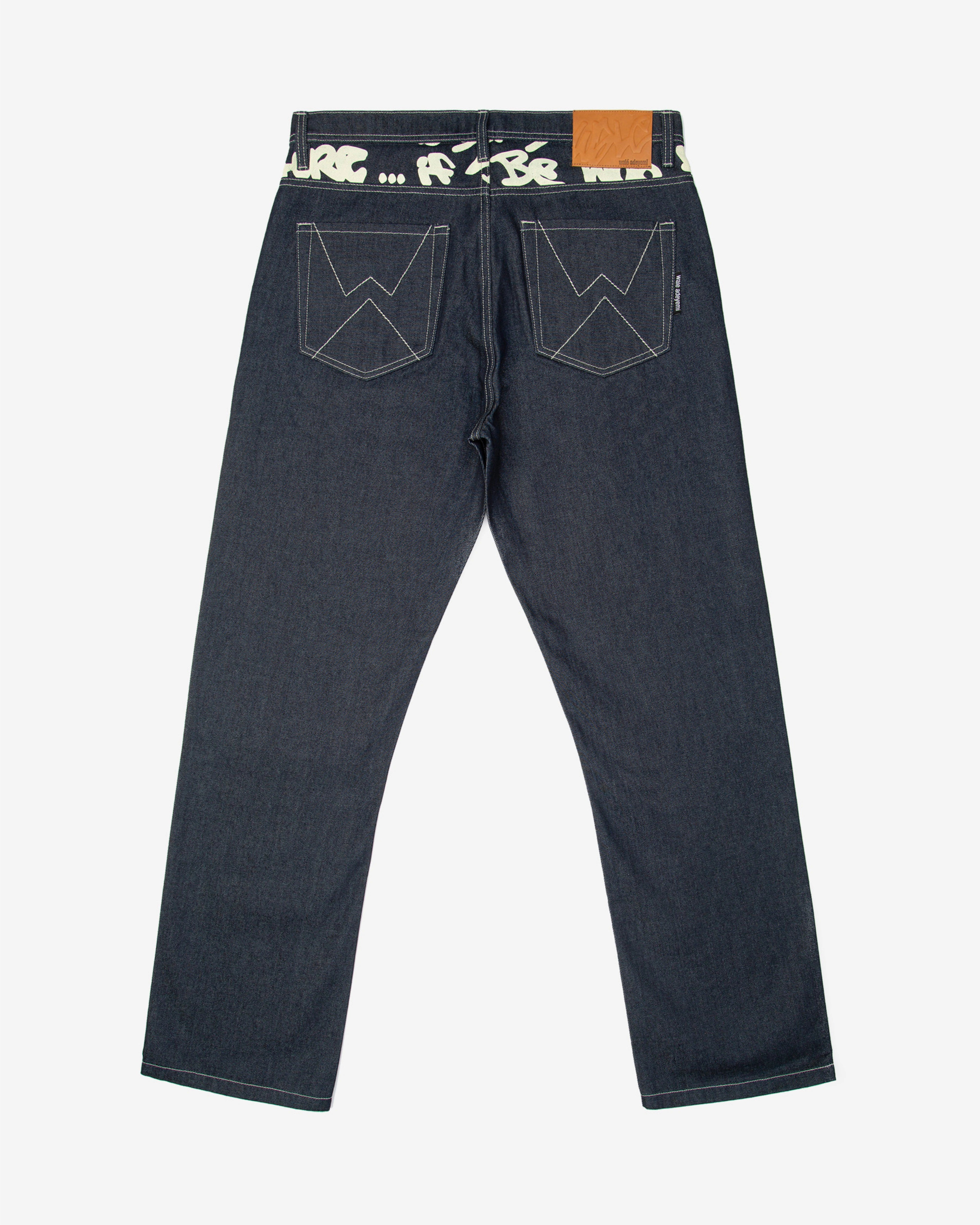 Walé Adeyemi Archive Graf Denim Jeans in Navy/Lemon, back flat-lay view showing the graffiti waistband, W stitch pockets and leather patch