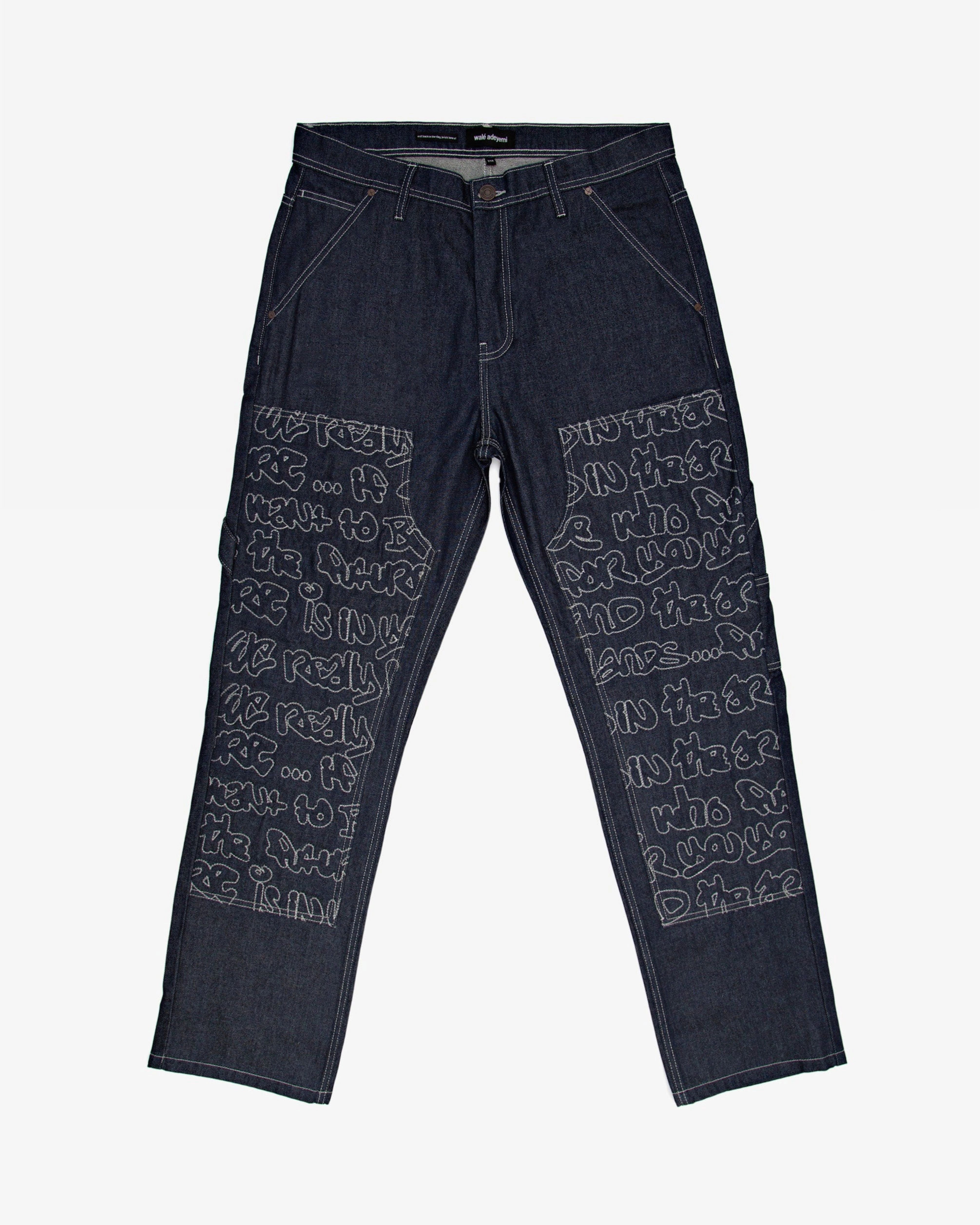 Archive Carpenter jeans in navy, flat lay — By Walé Adeyemi