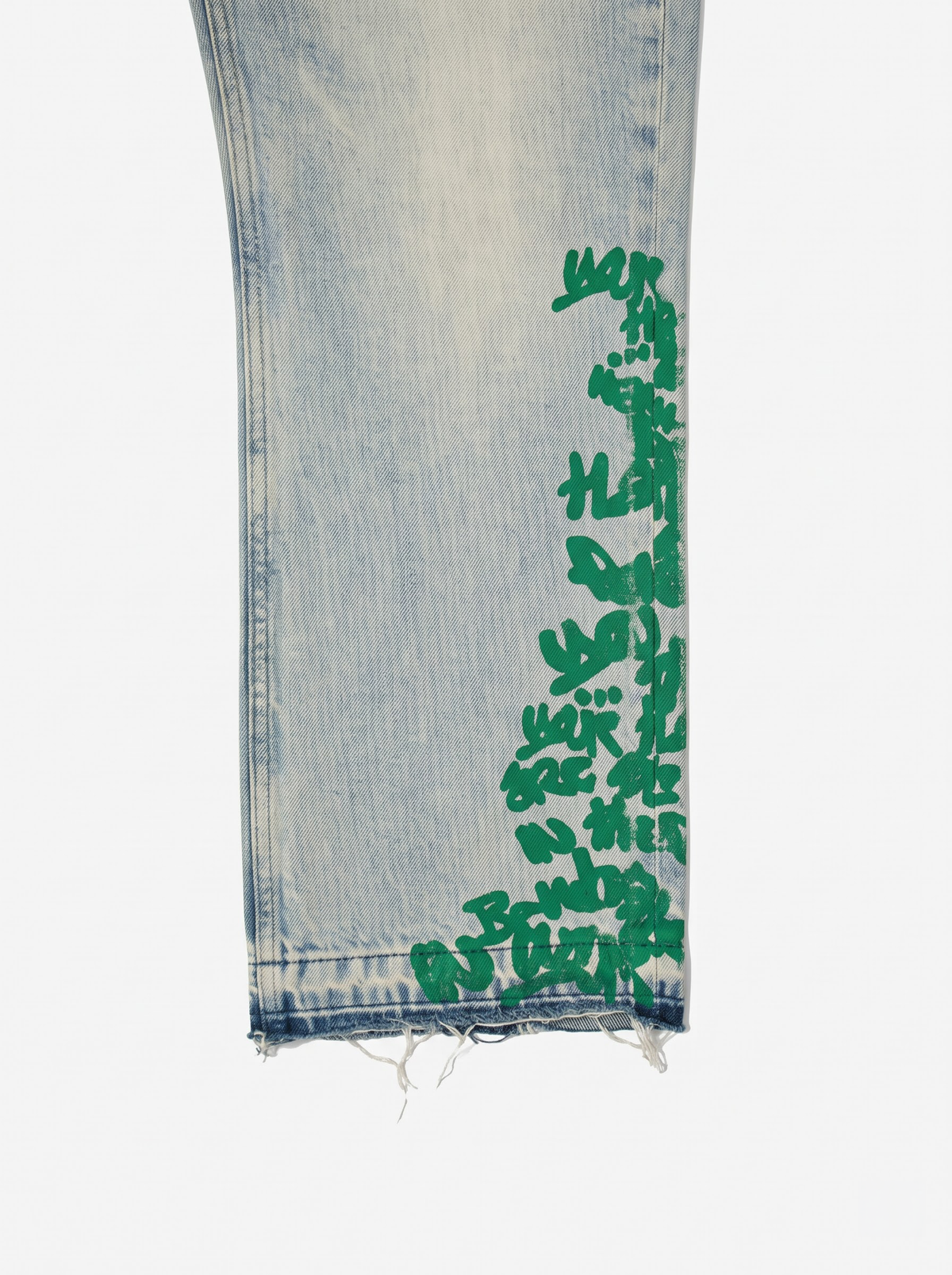 LP Custom Denim Jeans – Green, close-up of the green Broken Hendrix print and raw frayed back hem — By Walé Adeyemi