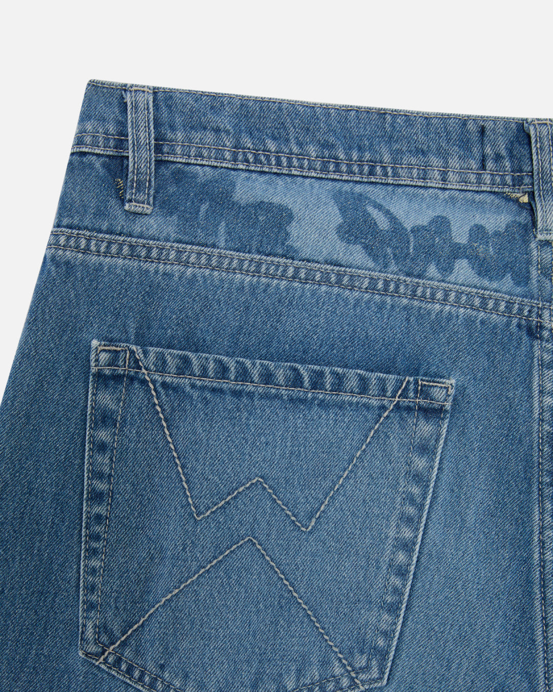 Close-up of the lasered Graf on the back yoke of Walé Adeyemi Phantom Denim Jeans in Faded