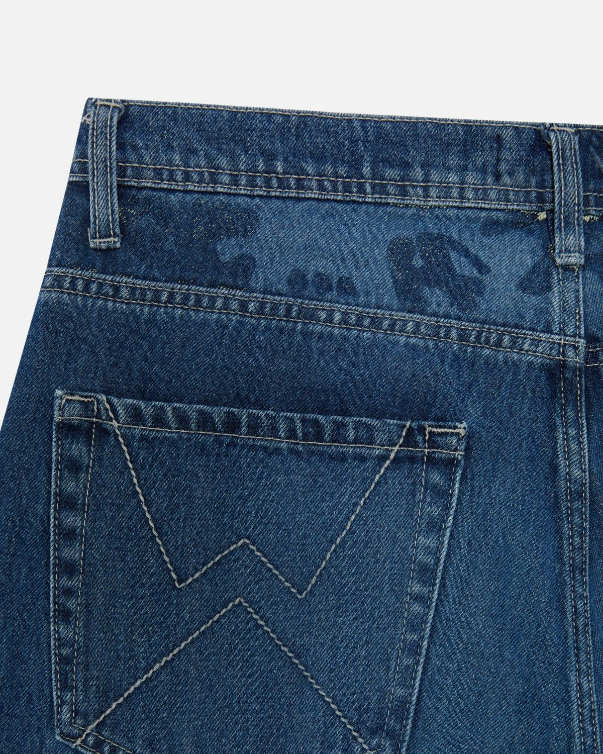 Close-up of the lasered Graf on the back yoke of Walé Adeyemi Phantom Denim Jeans in Ink