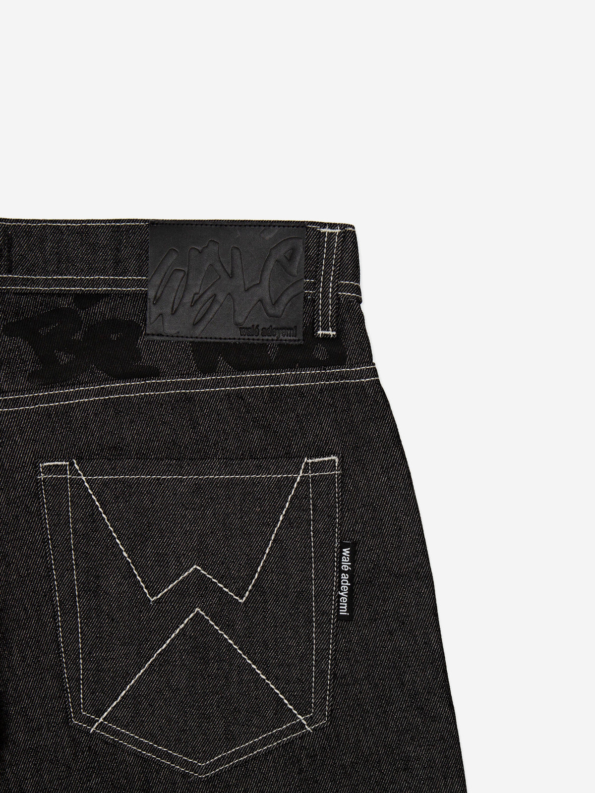 Close-up of the back pocket on the Walé Adeyemi Midnight Graf Denim Jeans in Black
