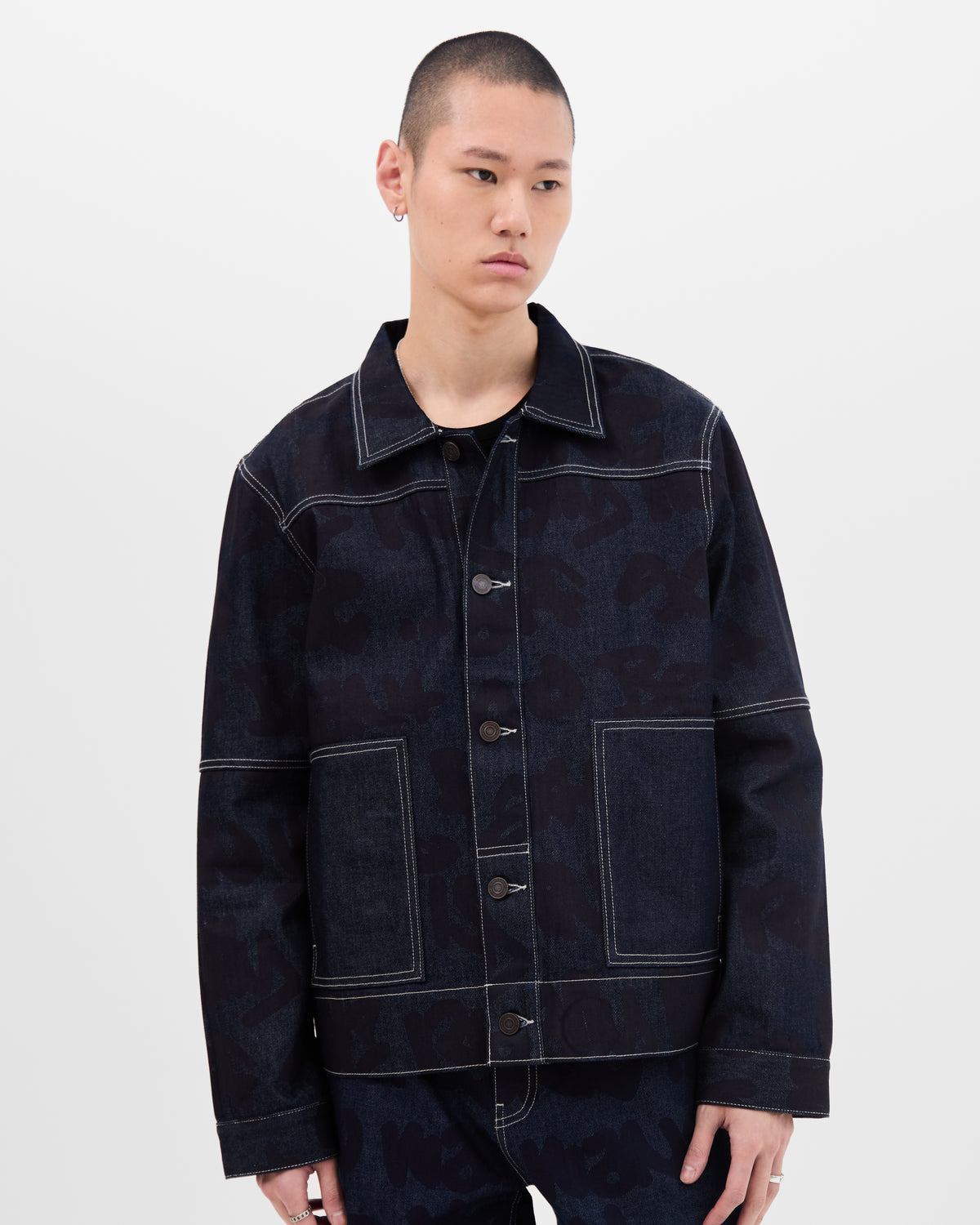 Model wearing dark blue denim jacket by Wale Adeyemi
