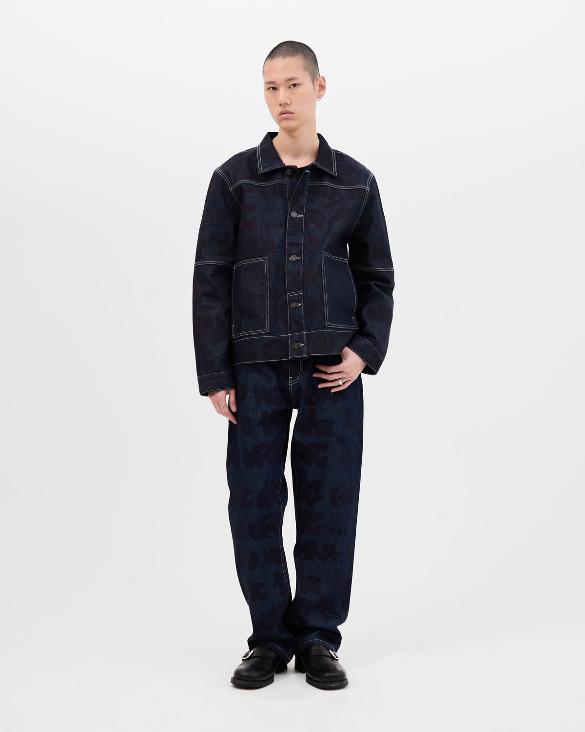 Model wearing dark blue denim jacket and jeans By Wale Adeyemi