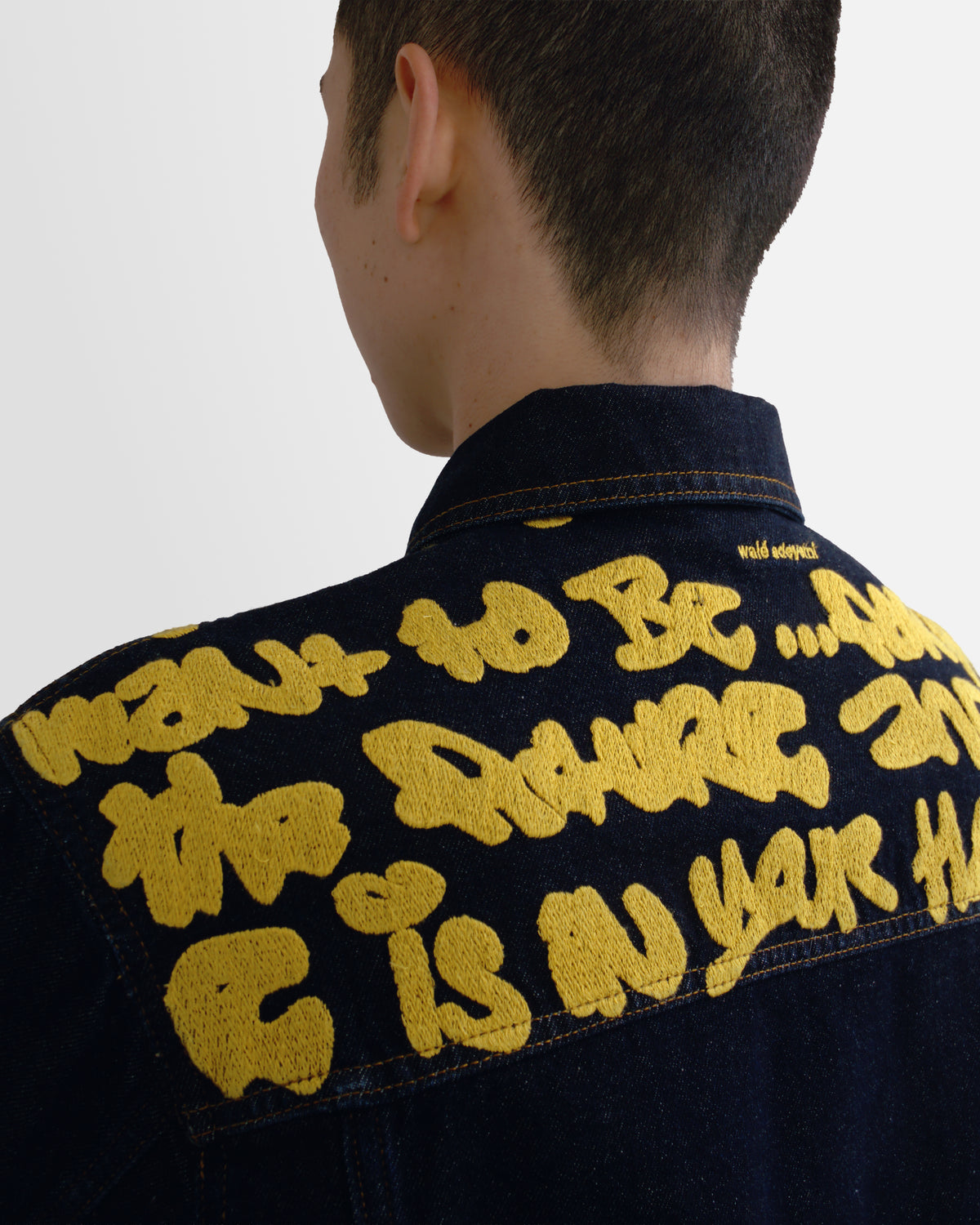 Walé Adeyemi Sessions Denim Jacket in Misted Yellow (raw rinse wash), on model, embroidered yoke graphic detail