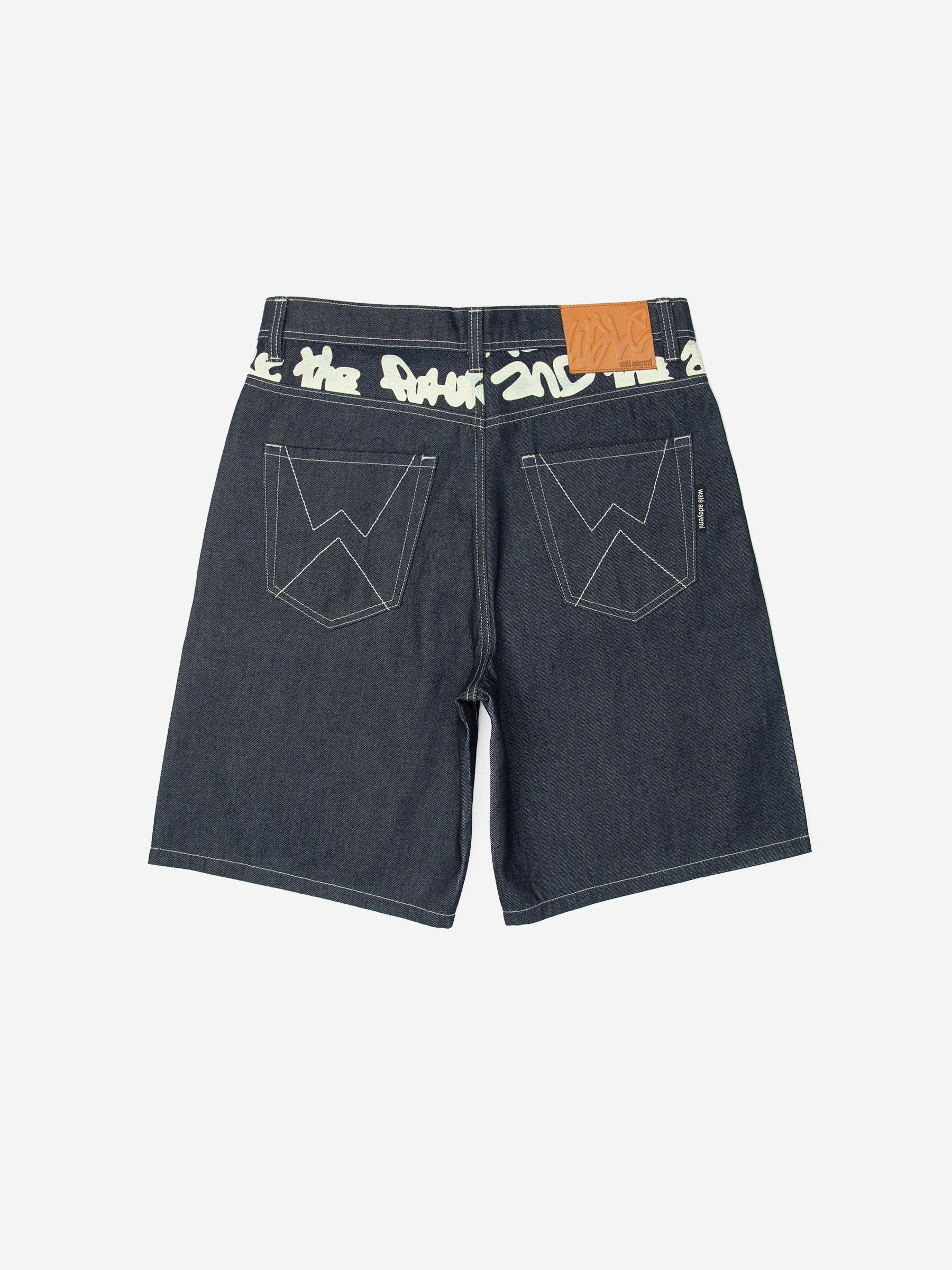 Walé Adeyemi Archive Graf Denim Shorts in Navy/Lemon, back flat-lay view showing the graffiti waistband and leather patch
