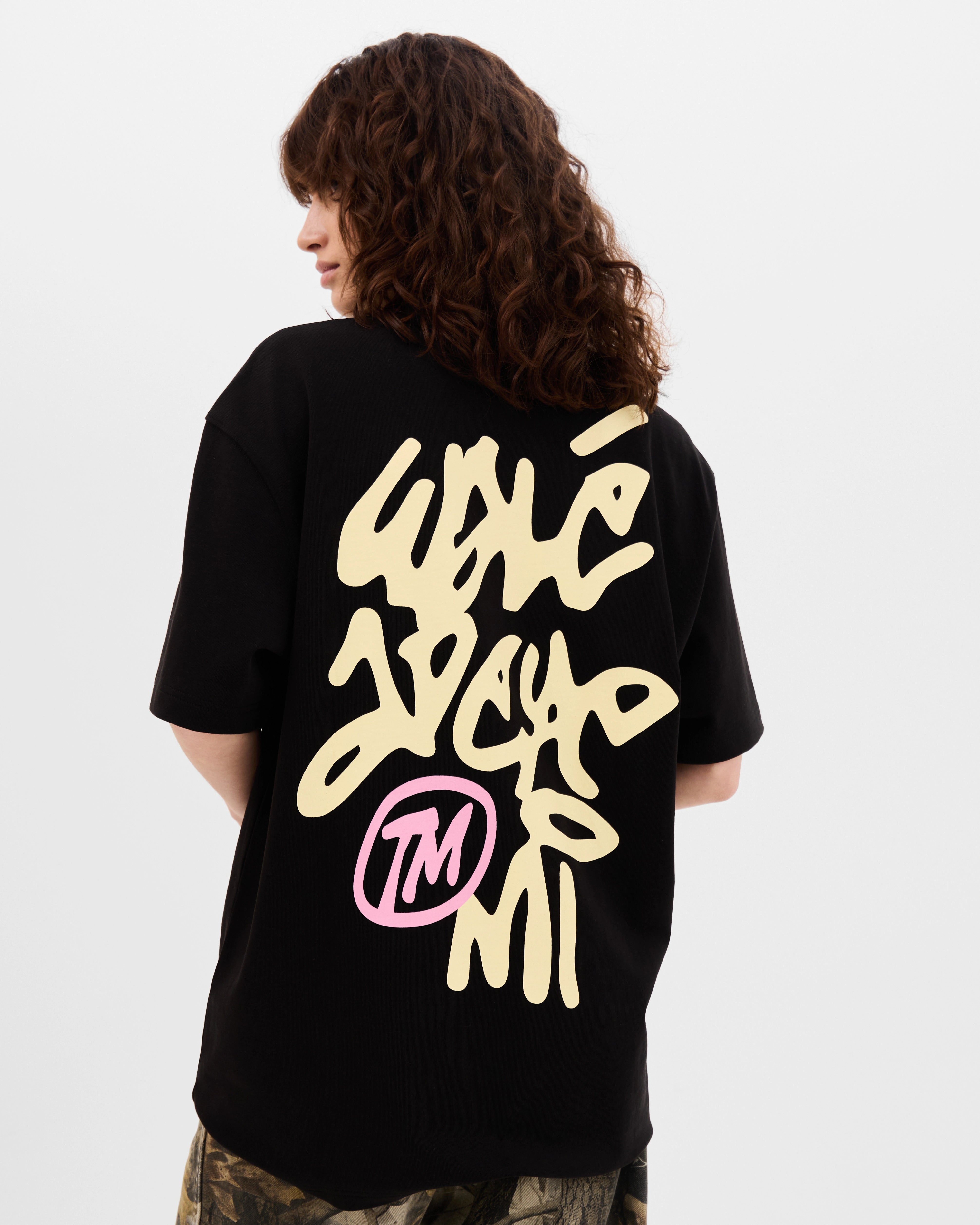 Model wearing the Walé Adeyemi Vinnie T-shirt in Black/Lemon, close back view
