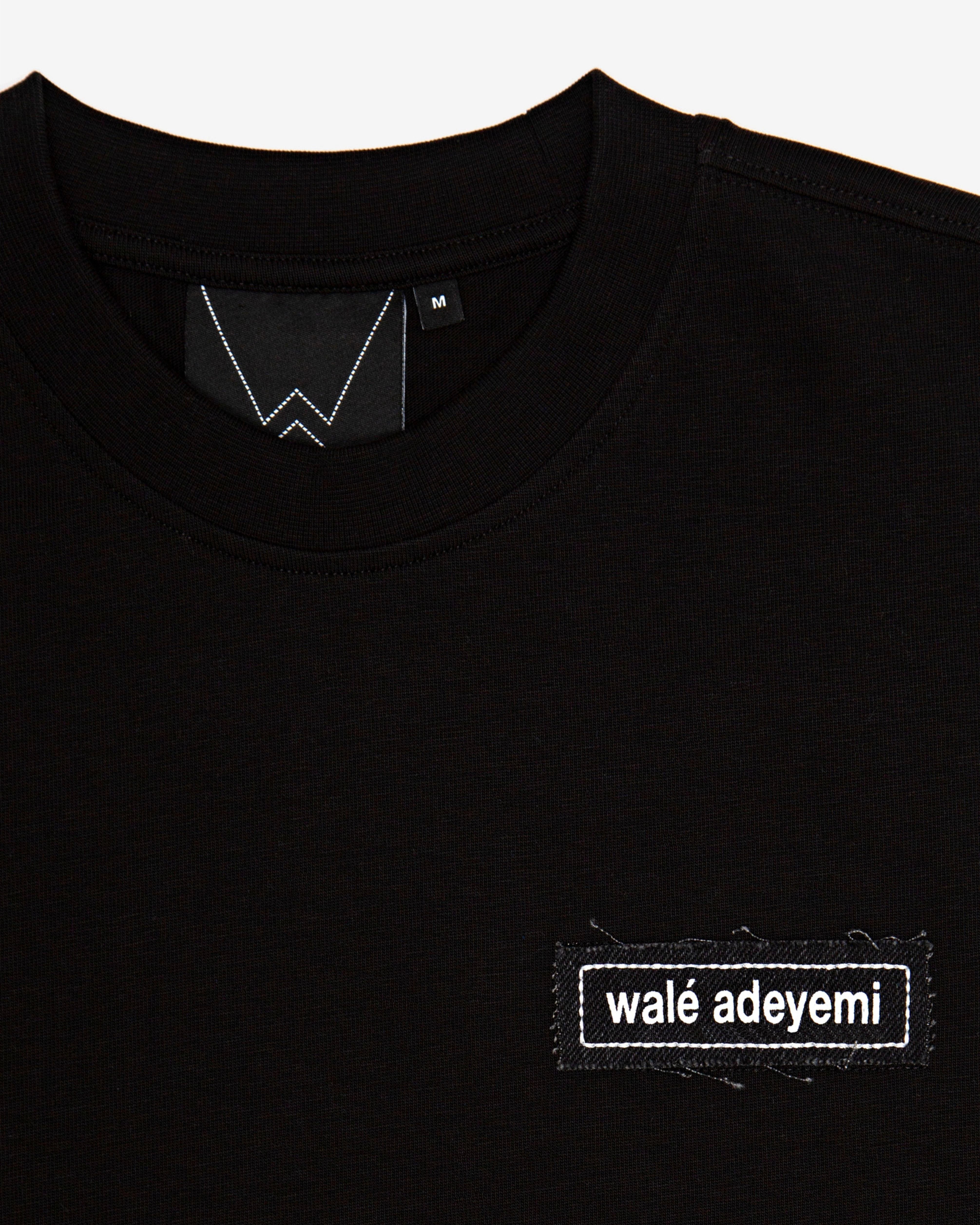 Close-up of the label on the Walé Adeyemi Backbeat T-shirt in Black/White
