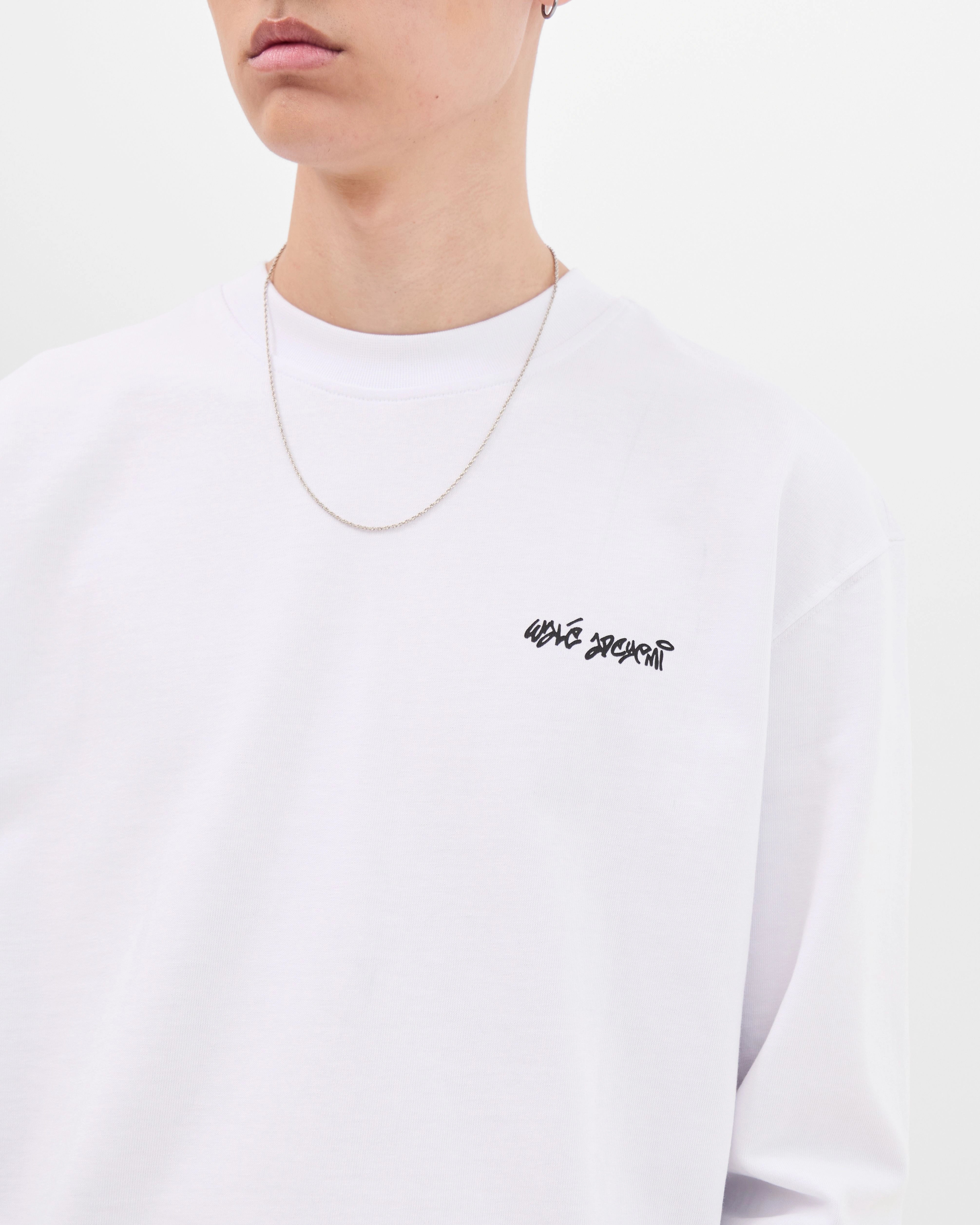 Close-up of the chest logo on the Walé Adeyemi Backbeat long-sleeve T-shirt in White/Blue