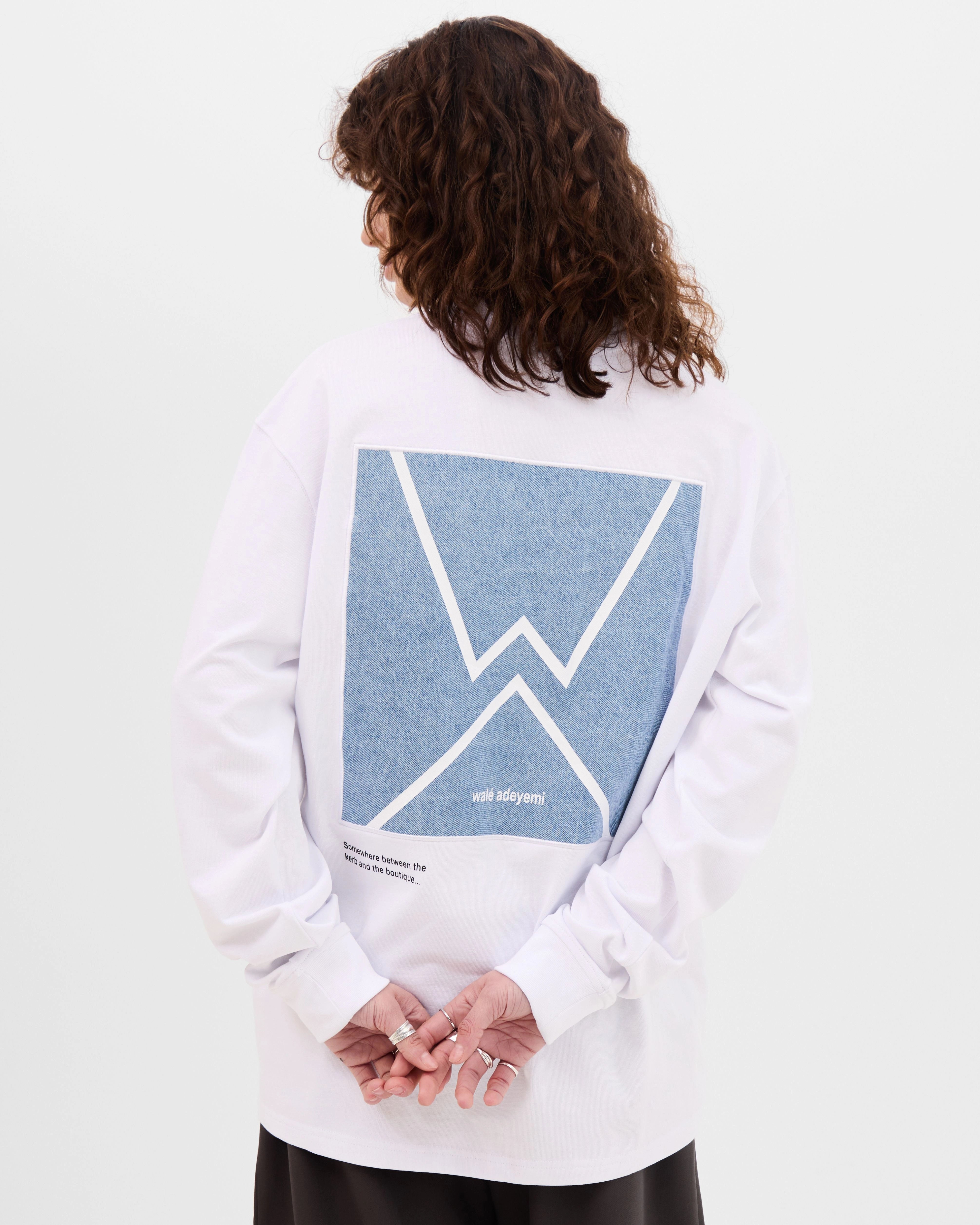 Model wearing the Walé Adeyemi Backbeat long-sleeve T-shirt in White/Blue, back view