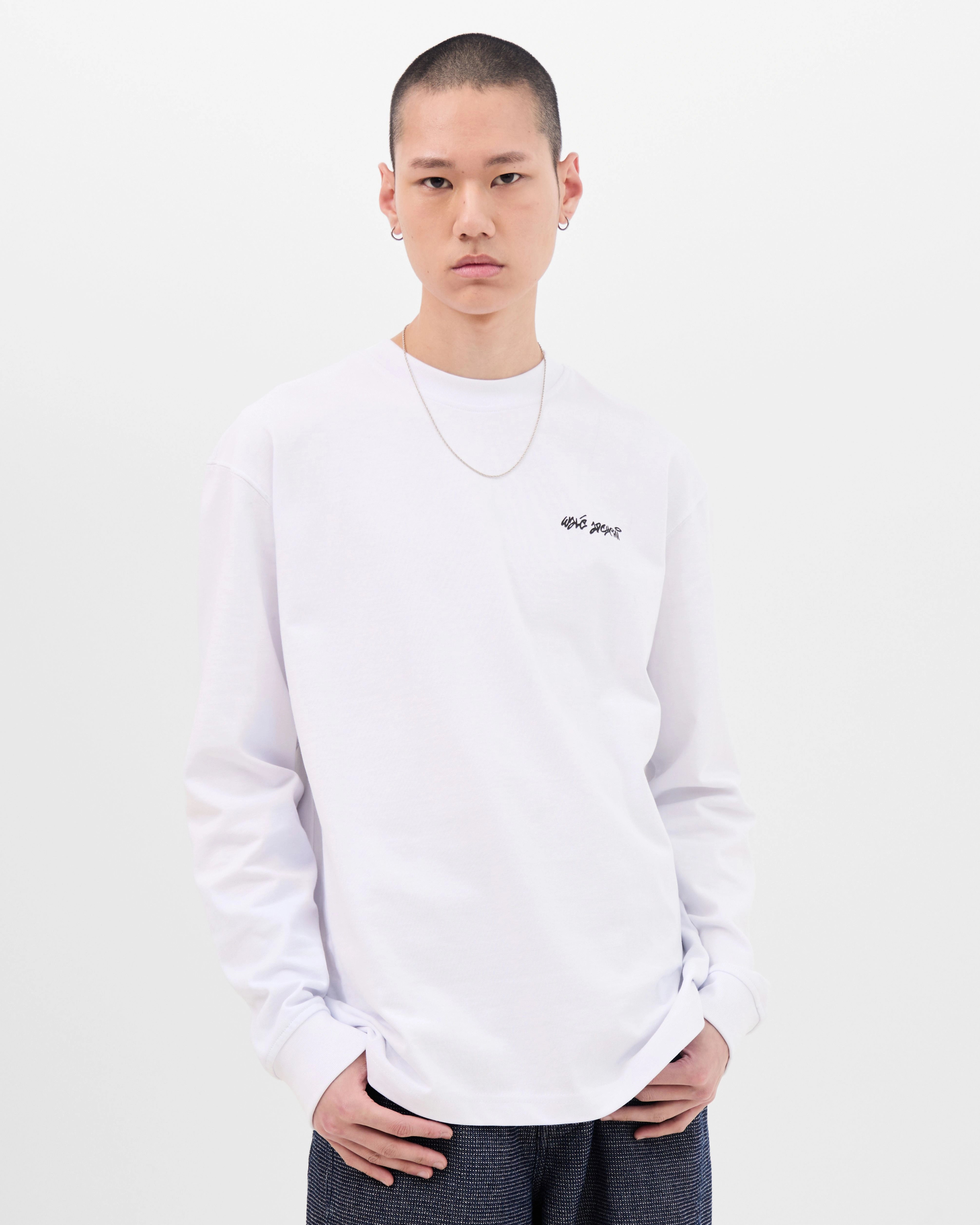 Model wearing the Walé Adeyemi Backbeat long-sleeve T-shirt in White/Blue, front view