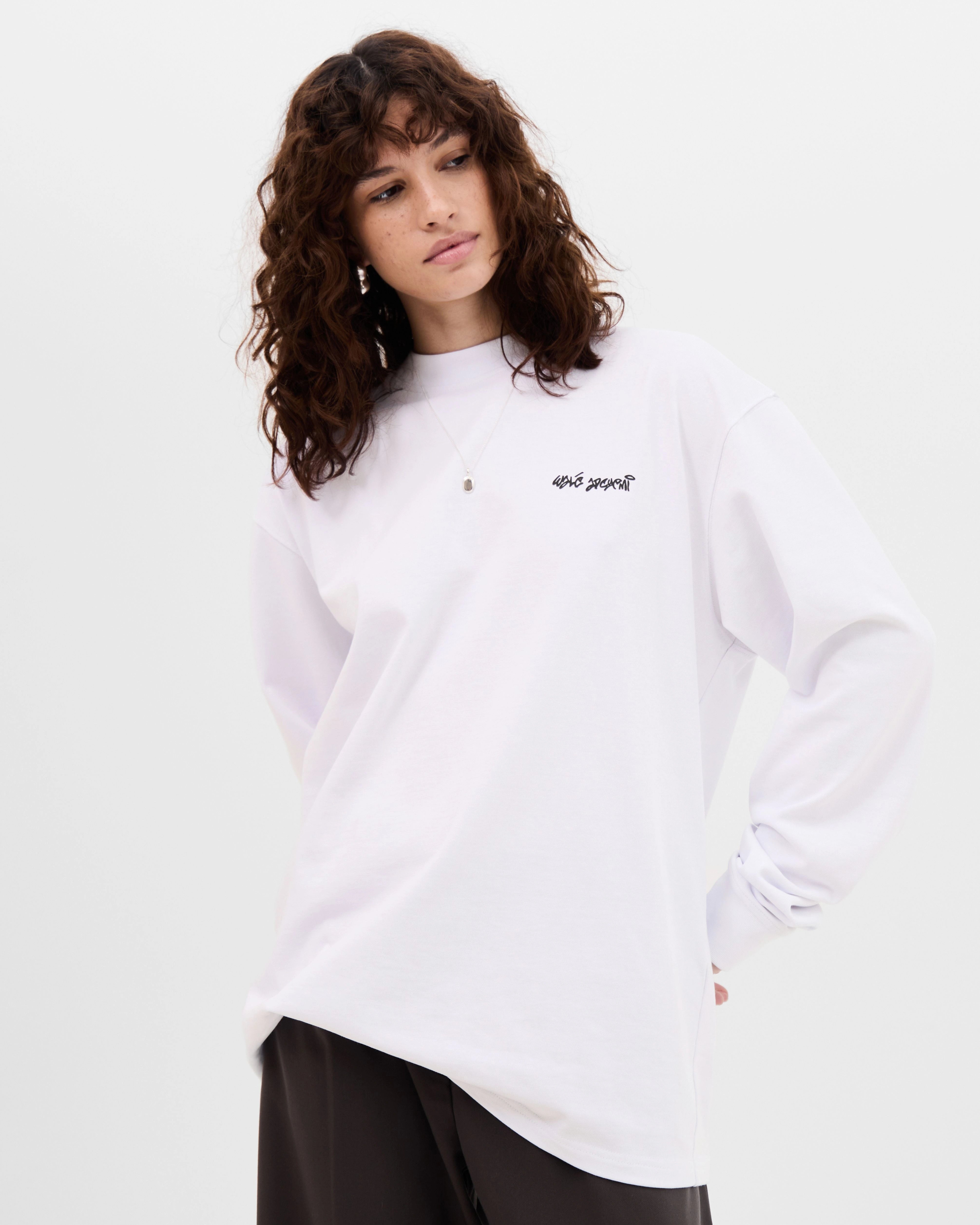 Model wearing the Walé Adeyemi Backbeat long-sleeve T-shirt in White/Blue, front view