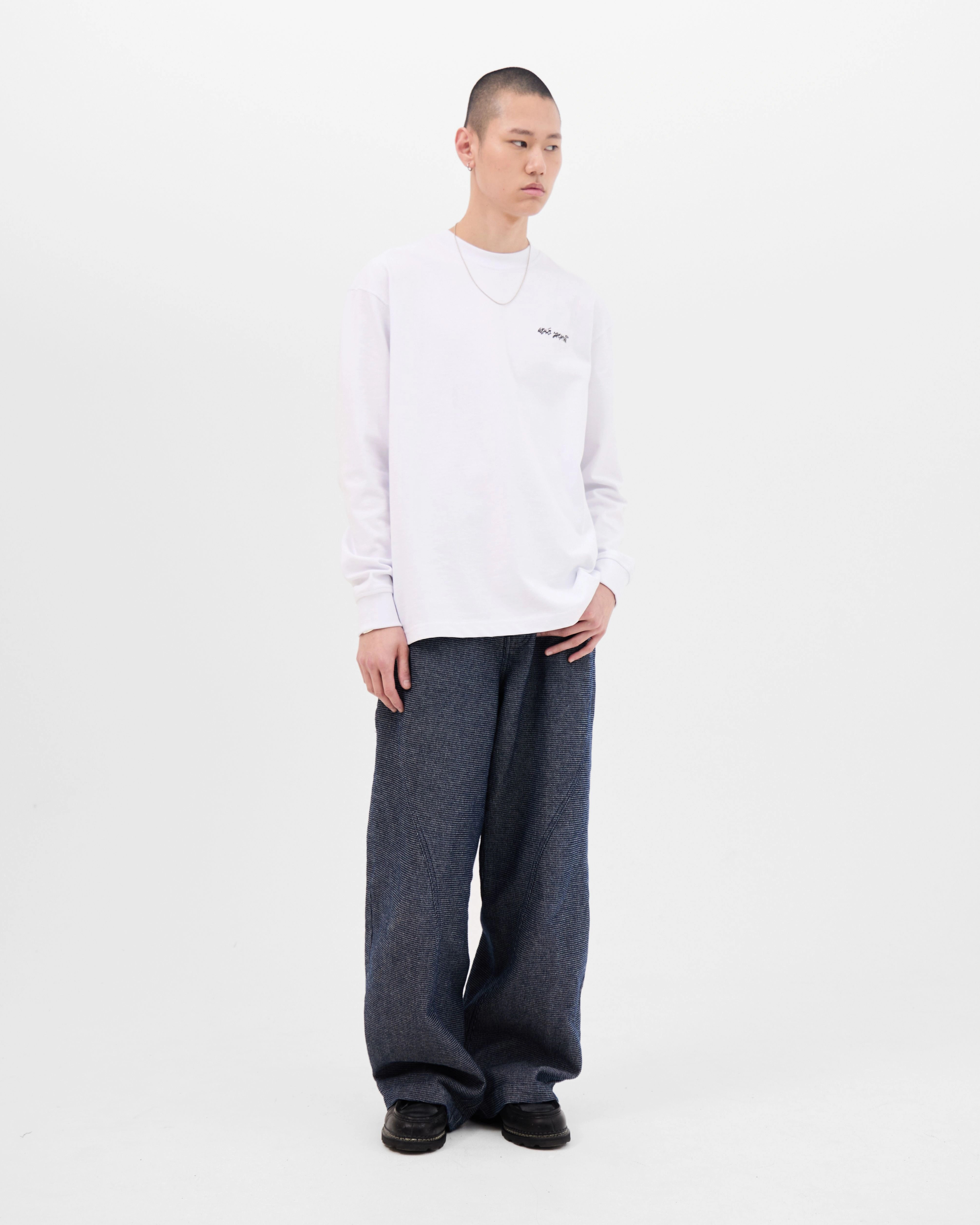 Model wearing the Walé Adeyemi Backbeat long-sleeve T-shirt in White/Blue, front view
