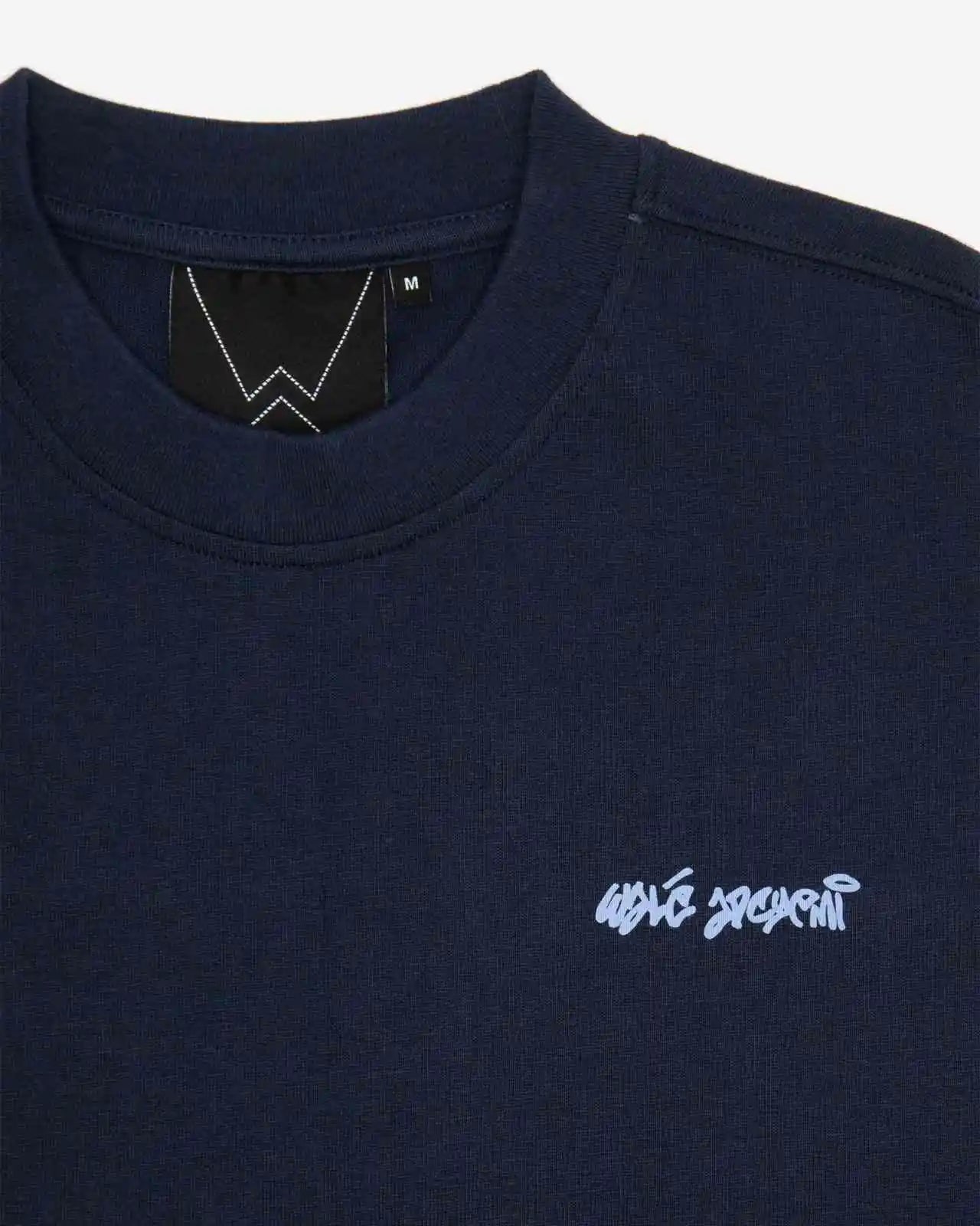 Close-up of the label on the Walé Adeyemi Column T-shirt in Blue/Light Blue