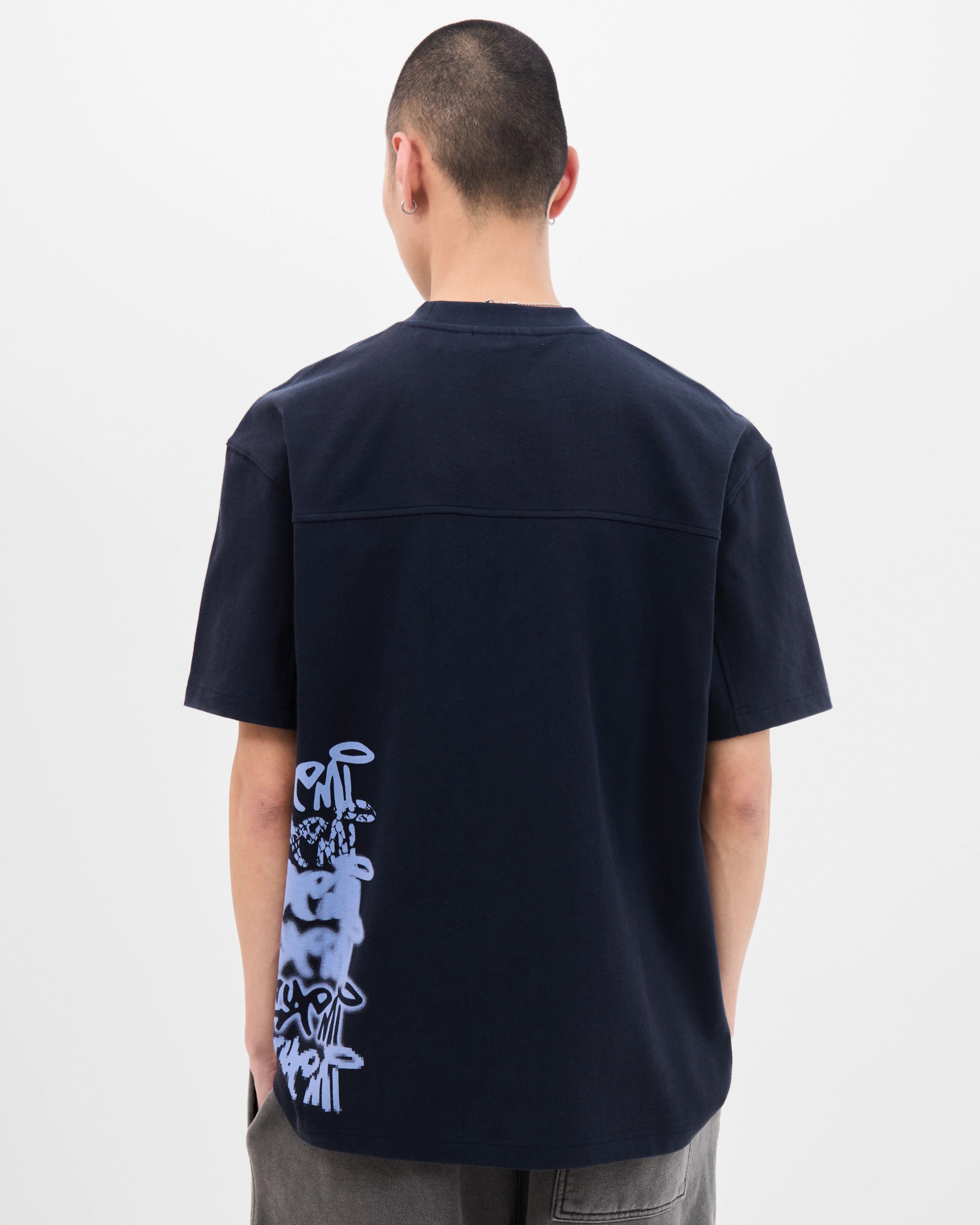 Model wearing the Walé Adeyemi Column T-shirt in Blue/Light Blue, back view