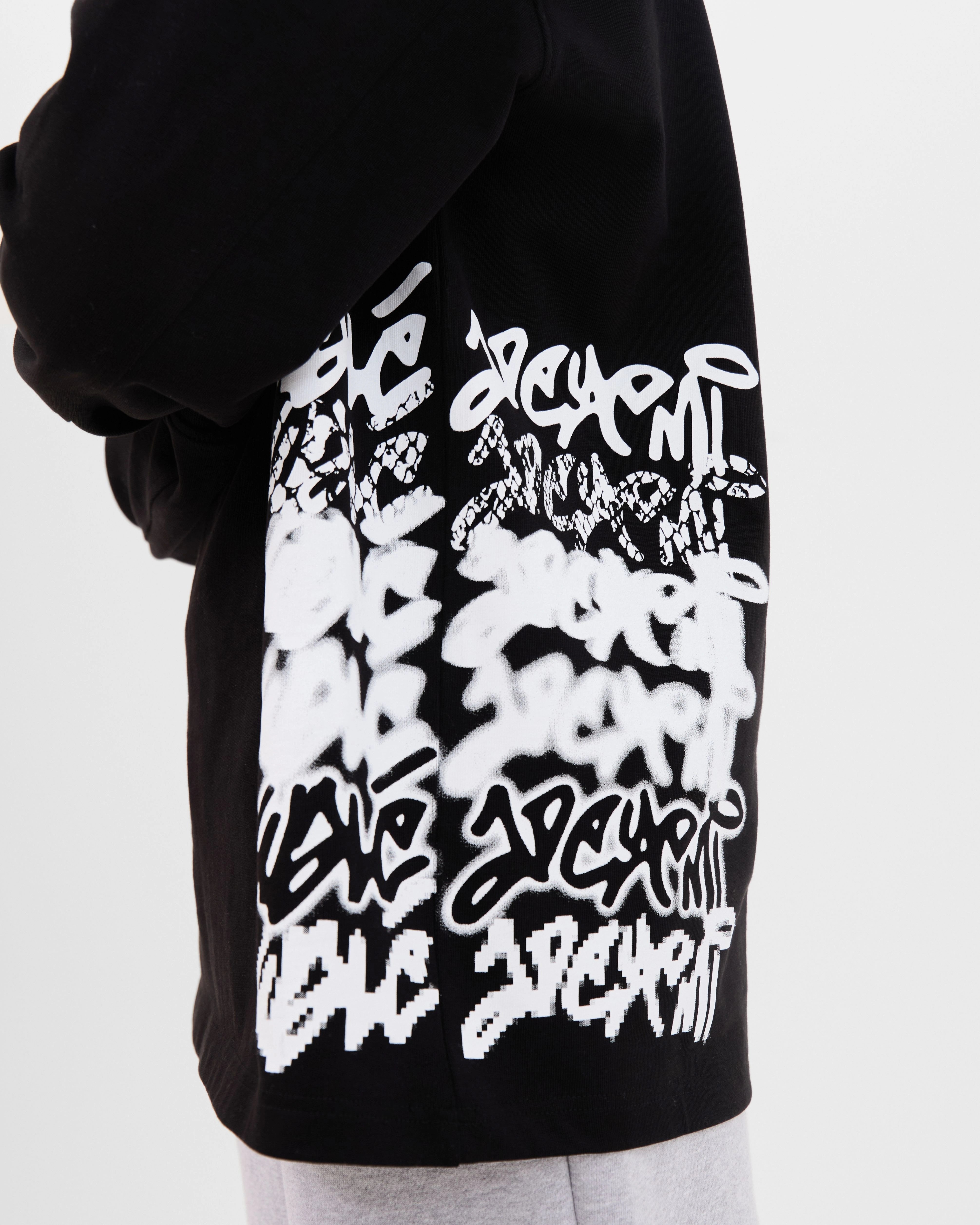 Close-up of the side print on the Walé Adeyemi Column long-sleeve T-shirt in Black/White