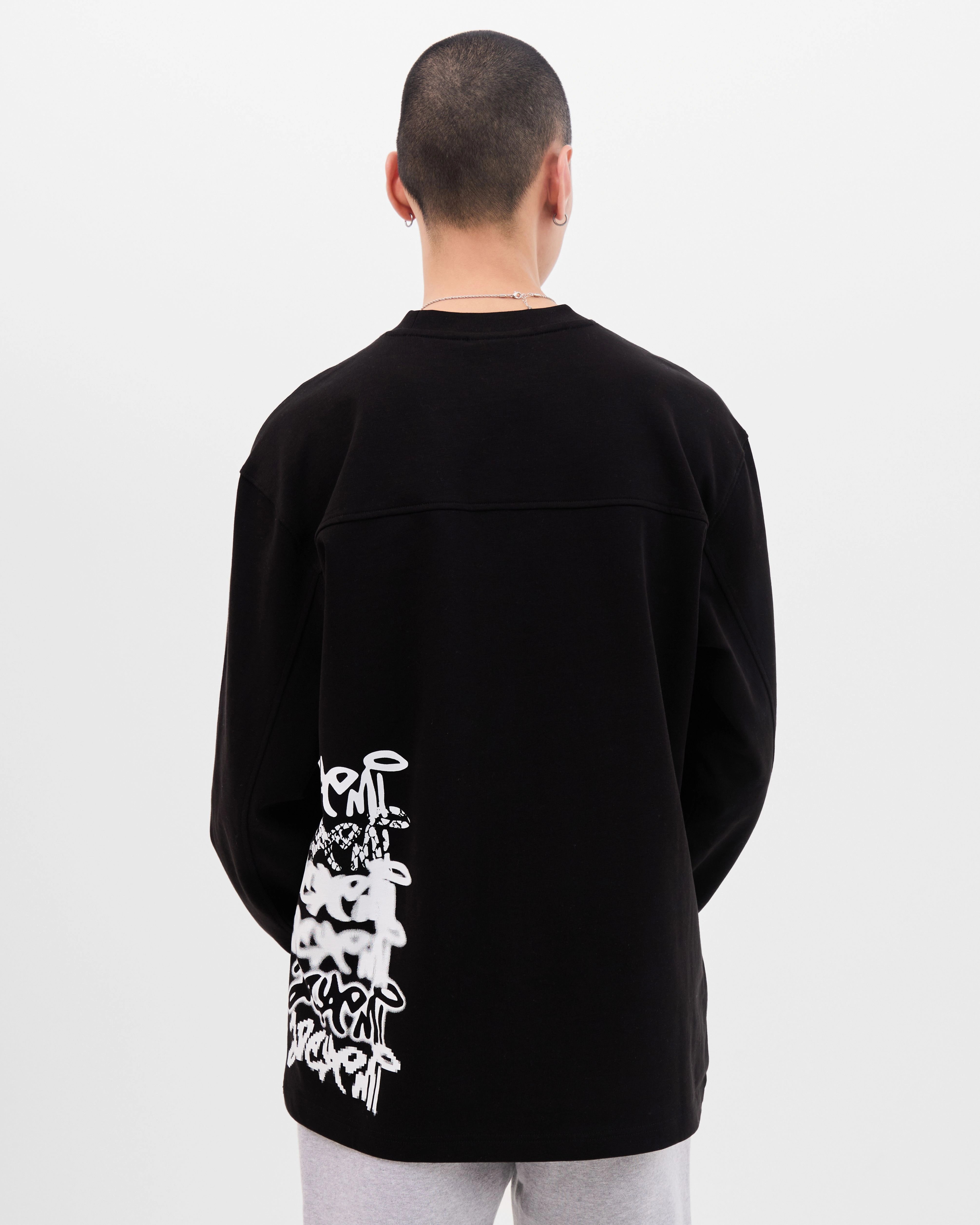Model wearing the Walé Adeyemi Column long-sleeve T-shirt in Black/White, alternate back view