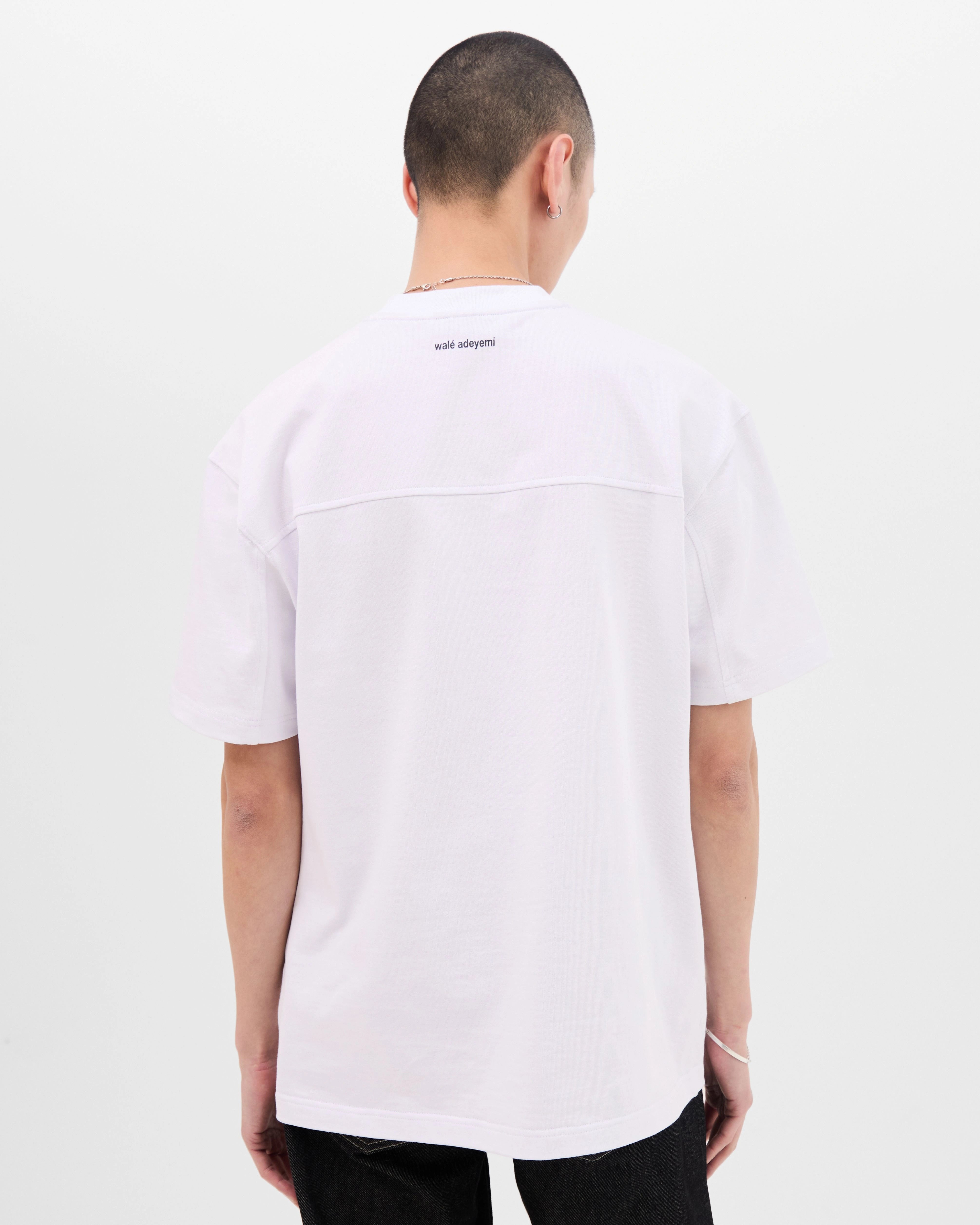 Model wearing the Walé Adeyemi Rhythm T-shirt in White/Black, back view