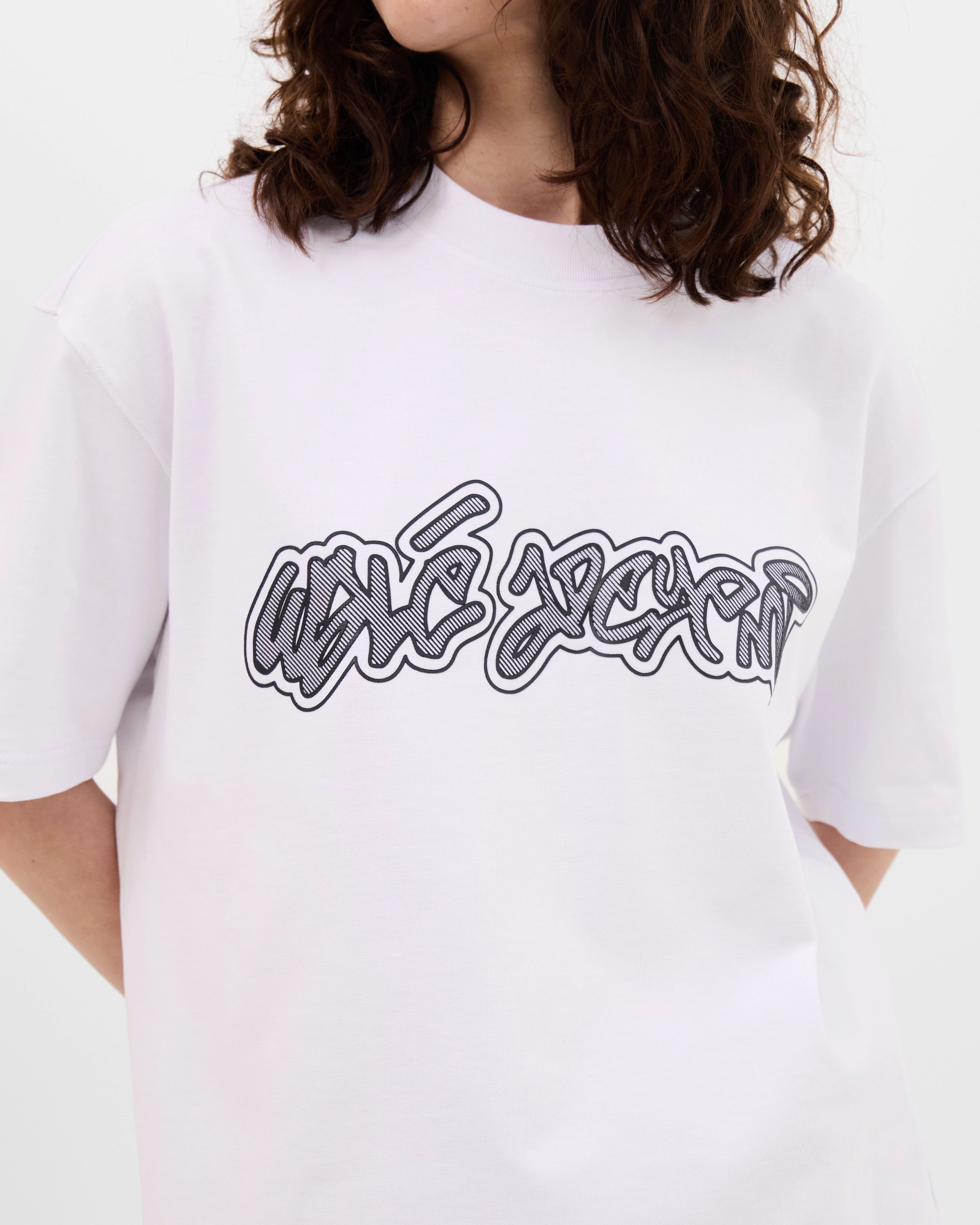 Model wearing the Walé Adeyemi Rhythm T-shirt in White/Black, alternate front view