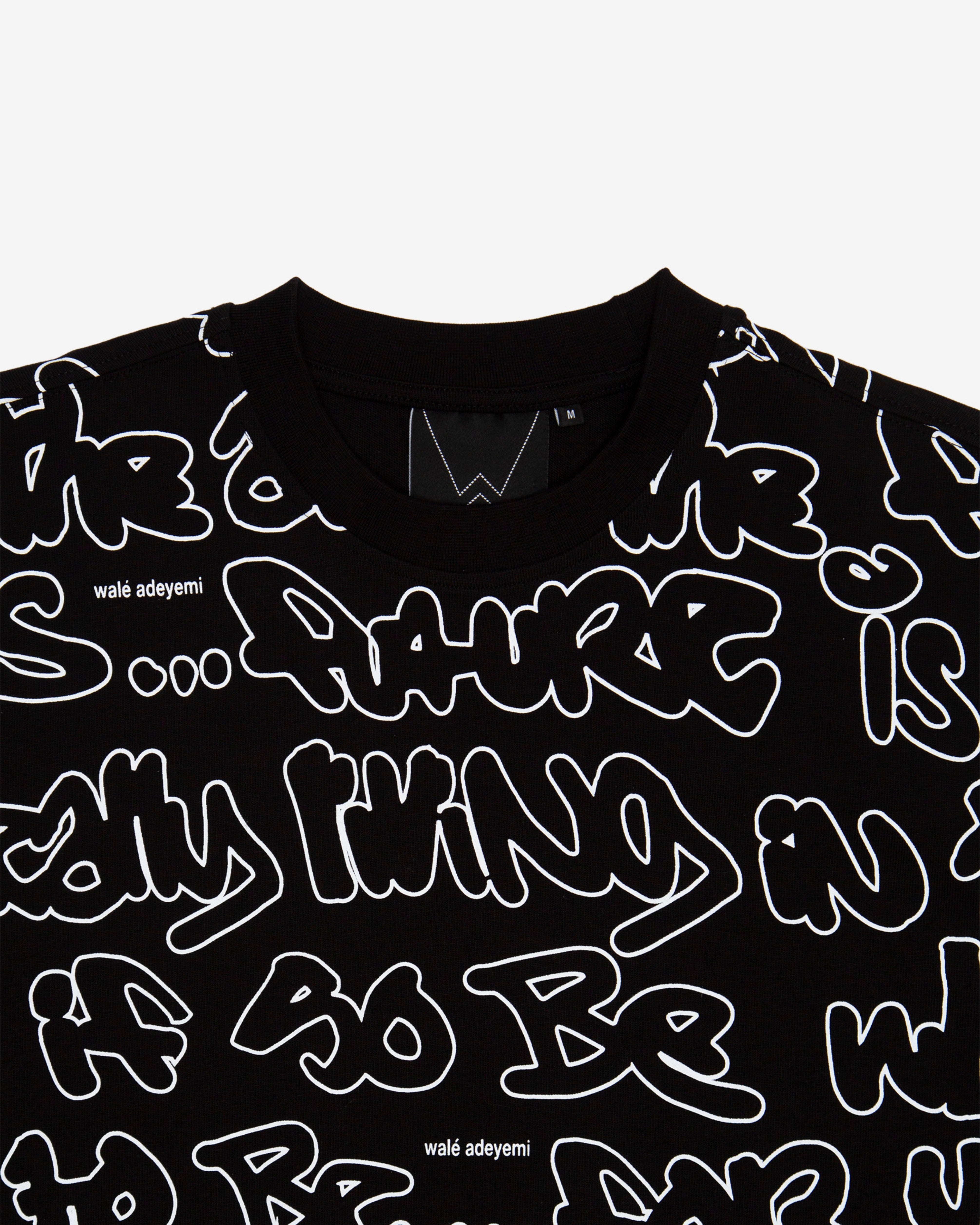 Close-up of the label on the Walé Adeyemi AOP Graf T-shirt in Black