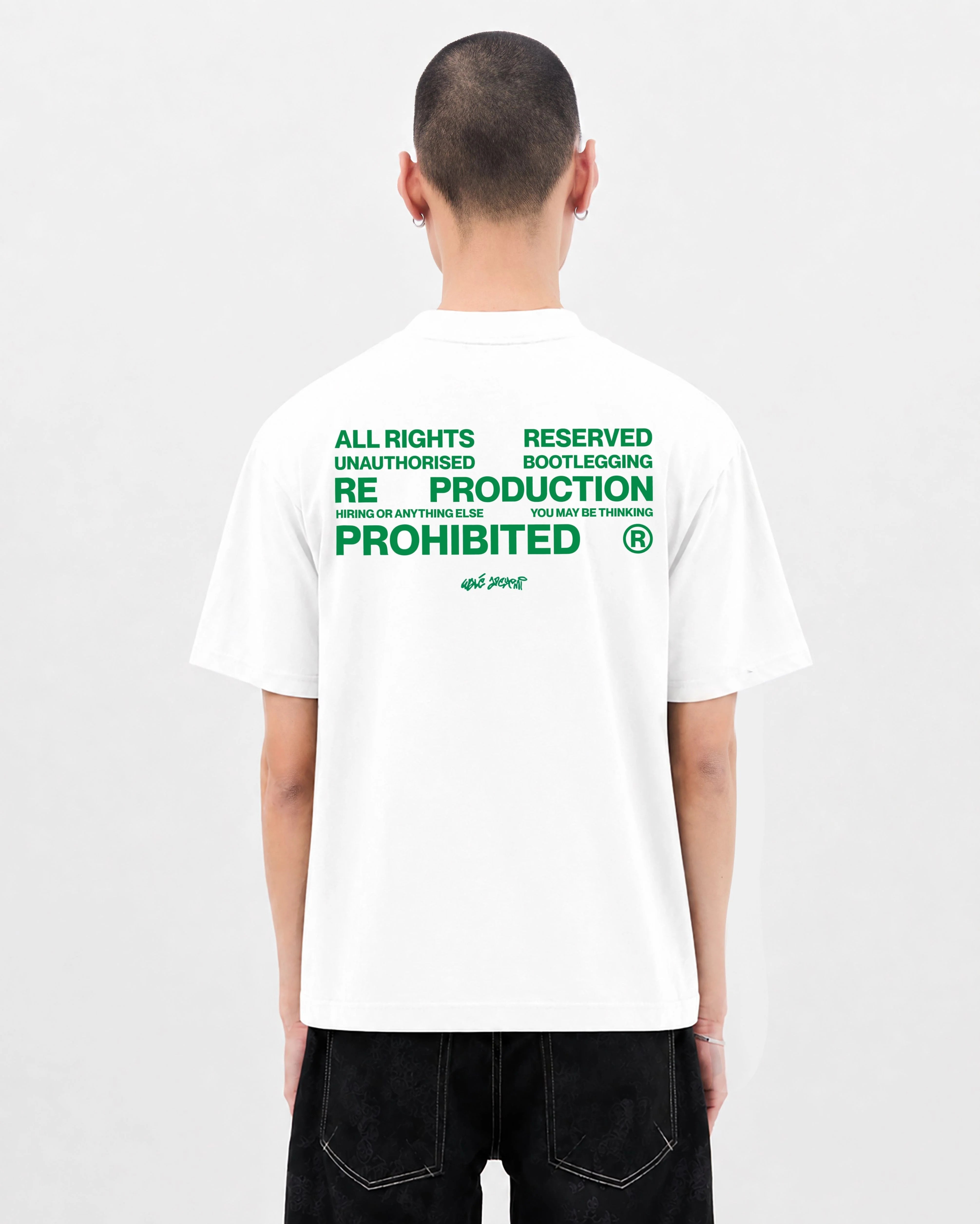 Model wearing the Walé Adeyemi Union T-shirt in White/Green, back view