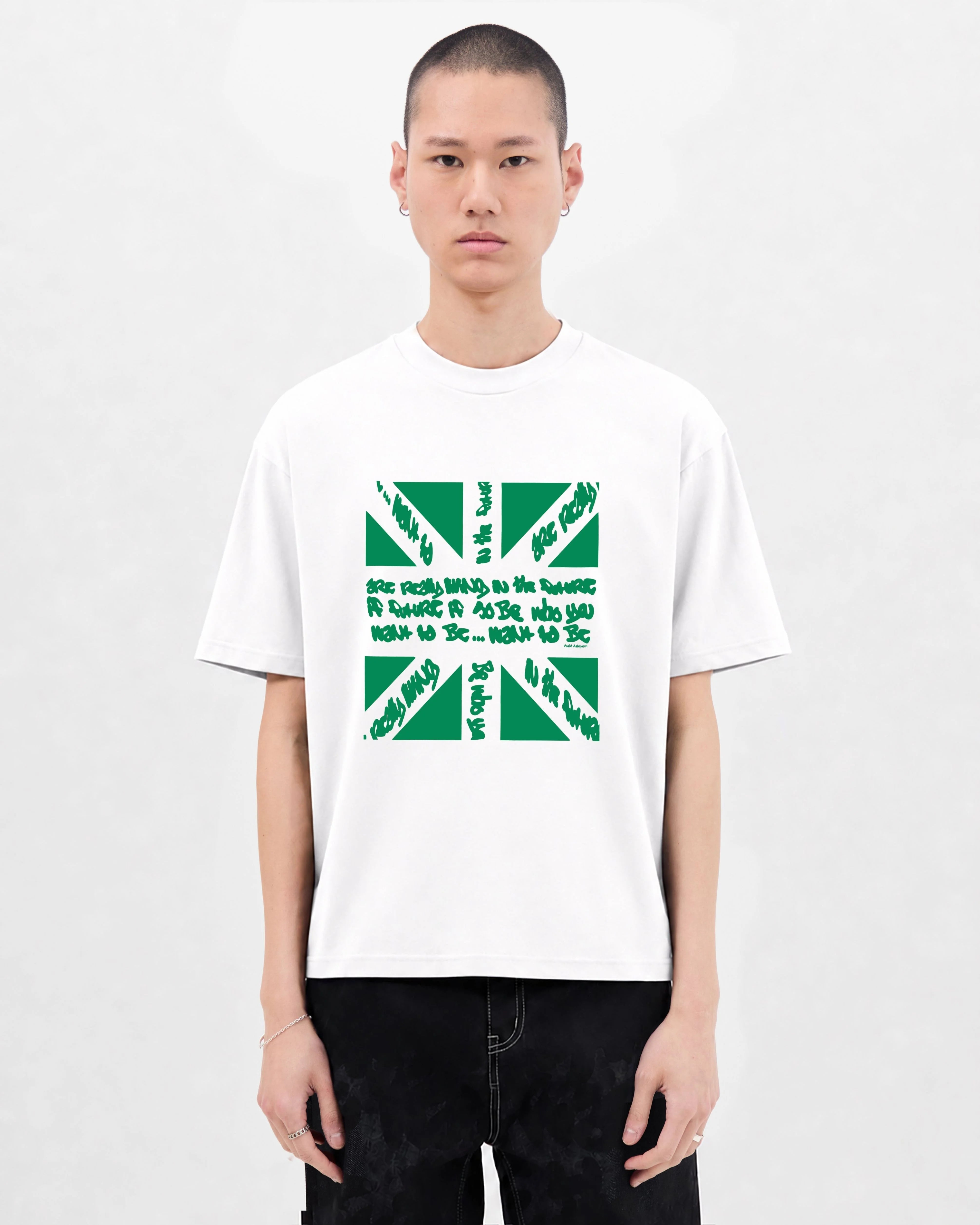 Model wearing the Walé Adeyemi Union T-shirt in White/Green, front view