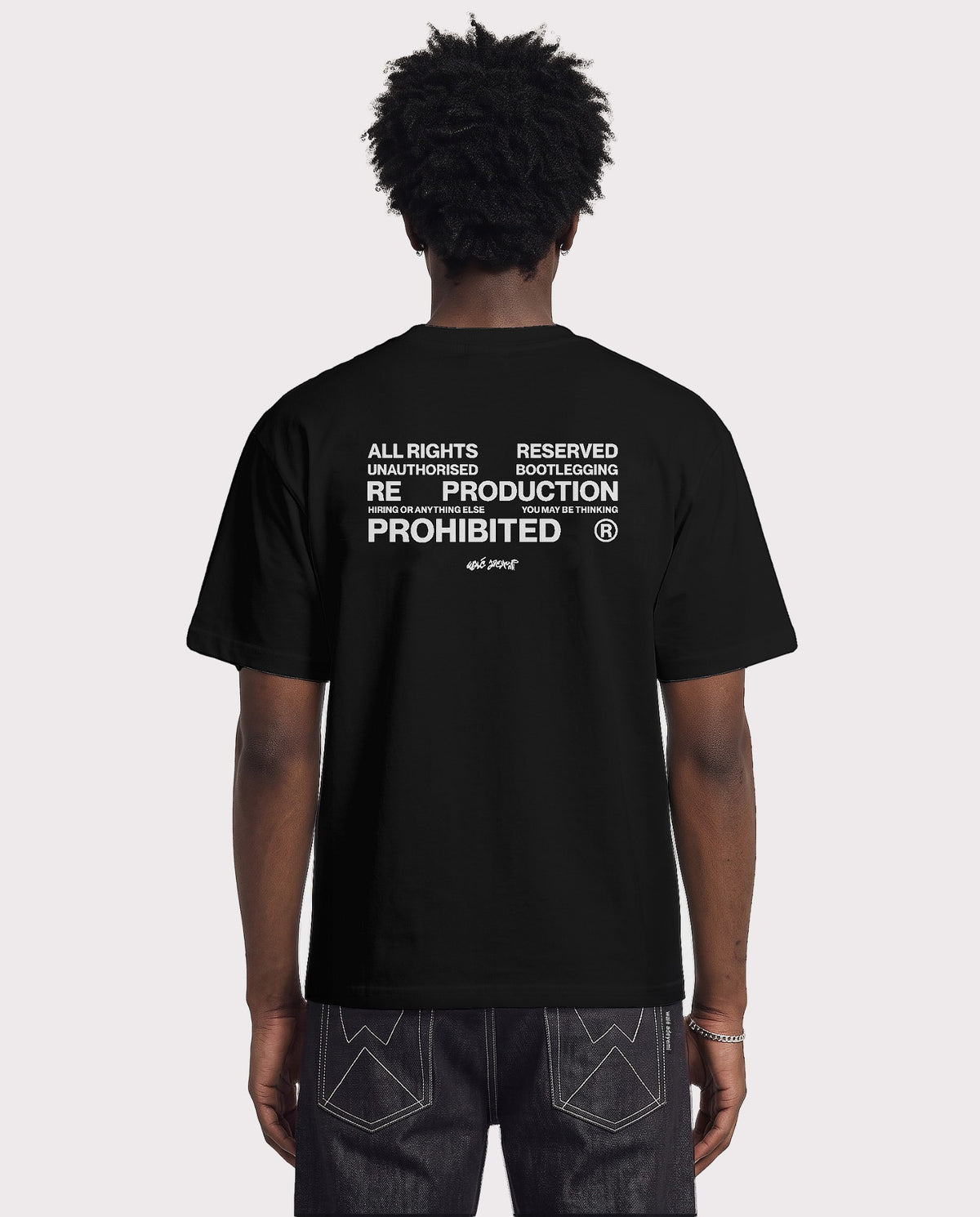 Model wearing the Walé Adeyemi Union T-shirt in Black/White, back view