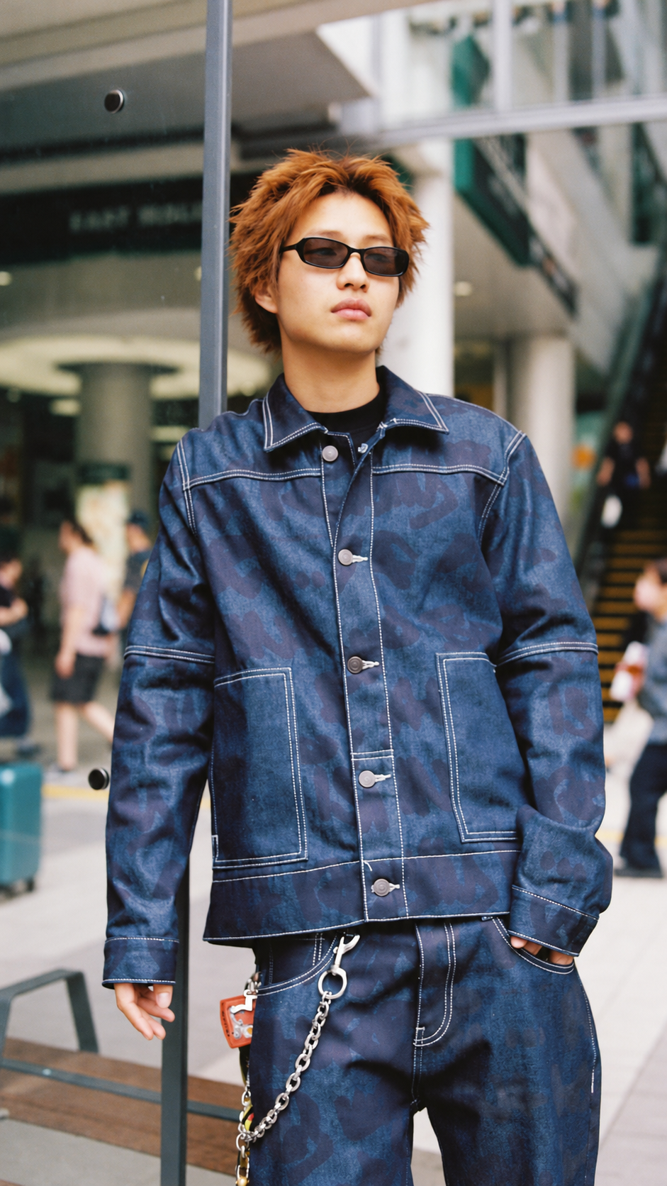 Model wearing a blue navy denim jacket by Wale adeyemi