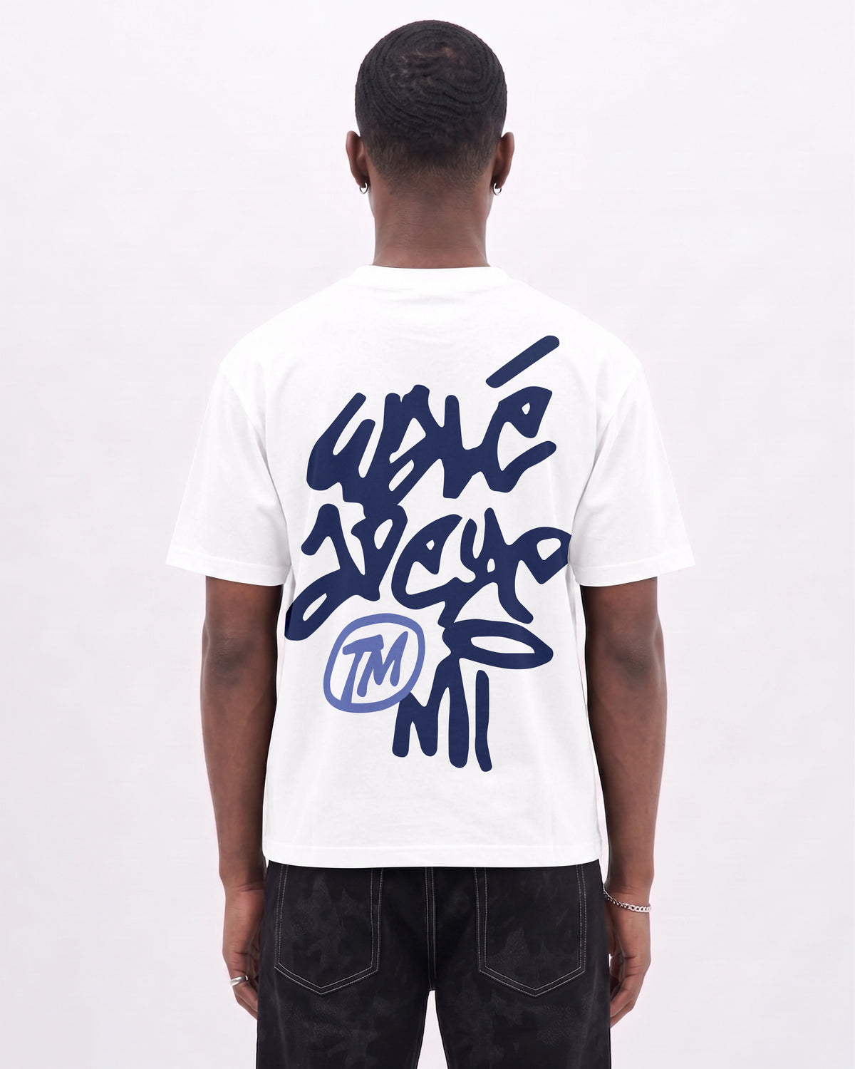Model wearing the Walé Adeyemi Vinnie T-shirt in White/Blue, back view