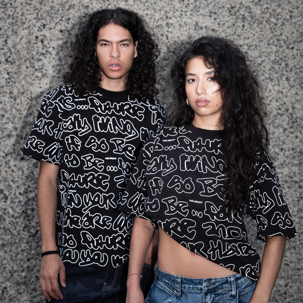 Man and women wearing wale adeyemi black grafti t shirt