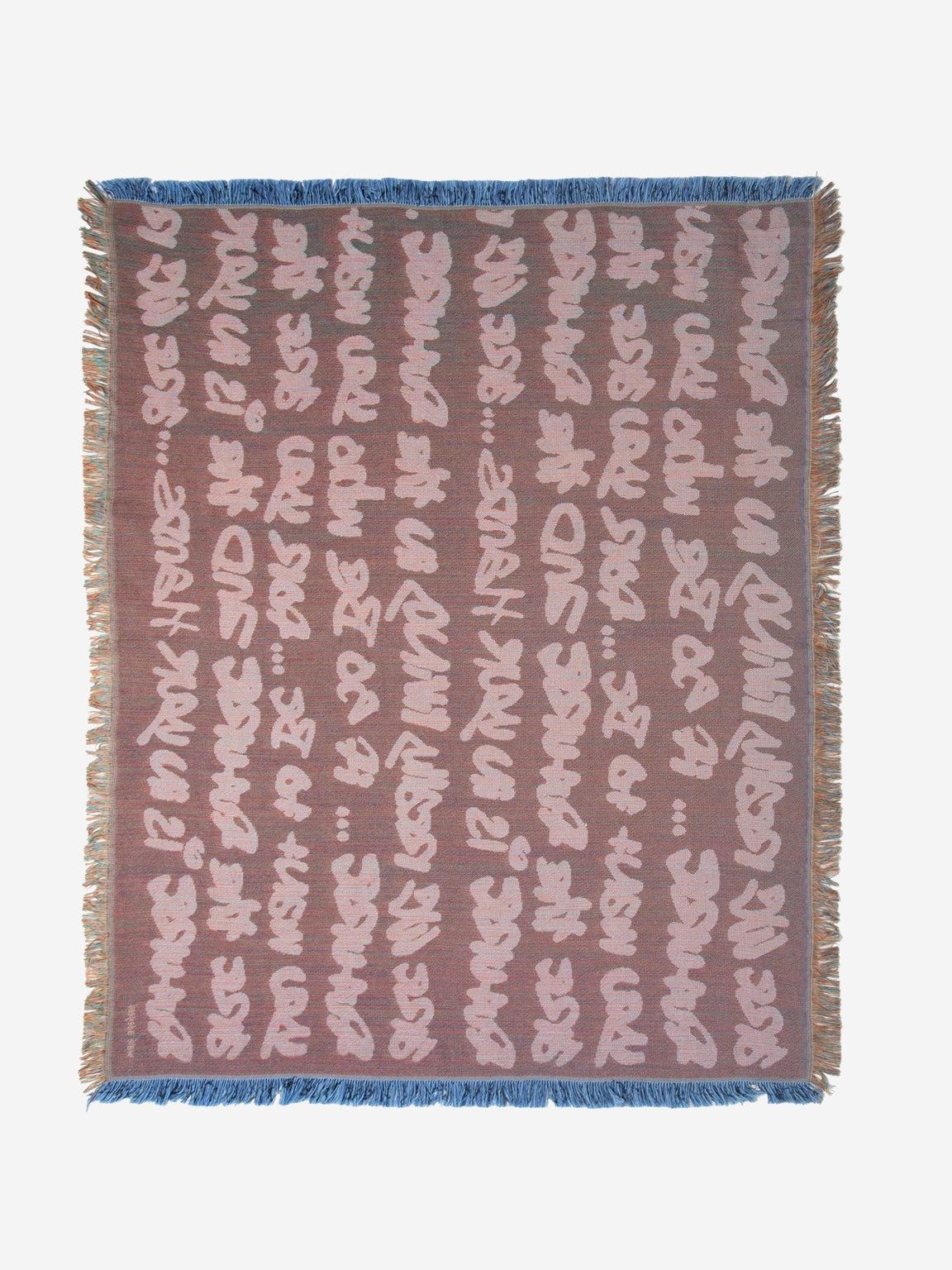 Graf Woven Throw detail showing textured woven construction and multicoloured fringed finish
